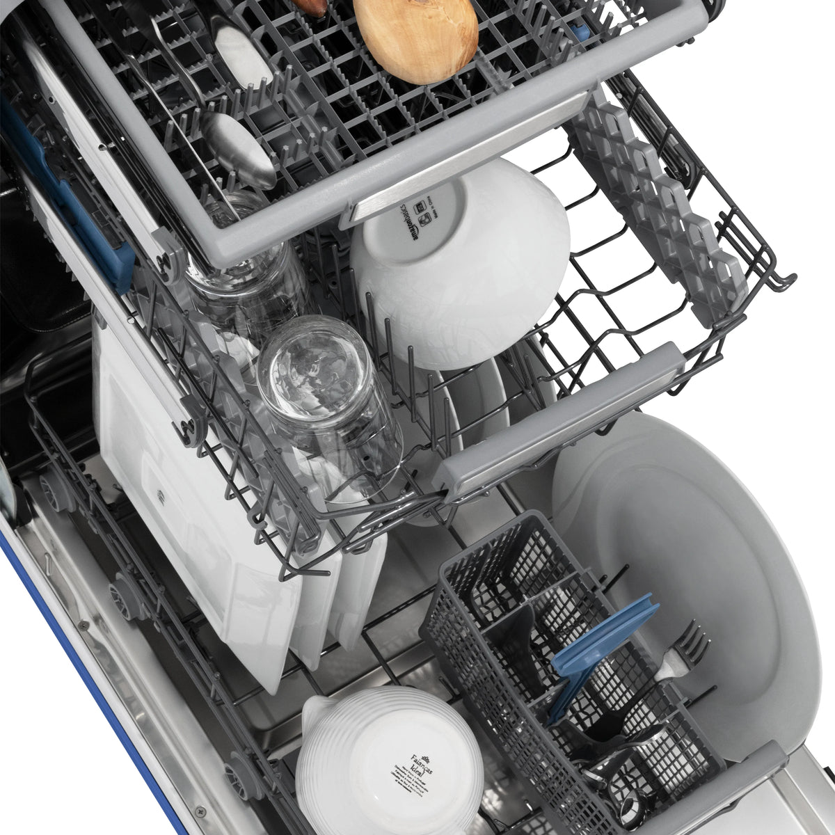 Dishwasher interior with upper rack, spray arm, and stainless basin