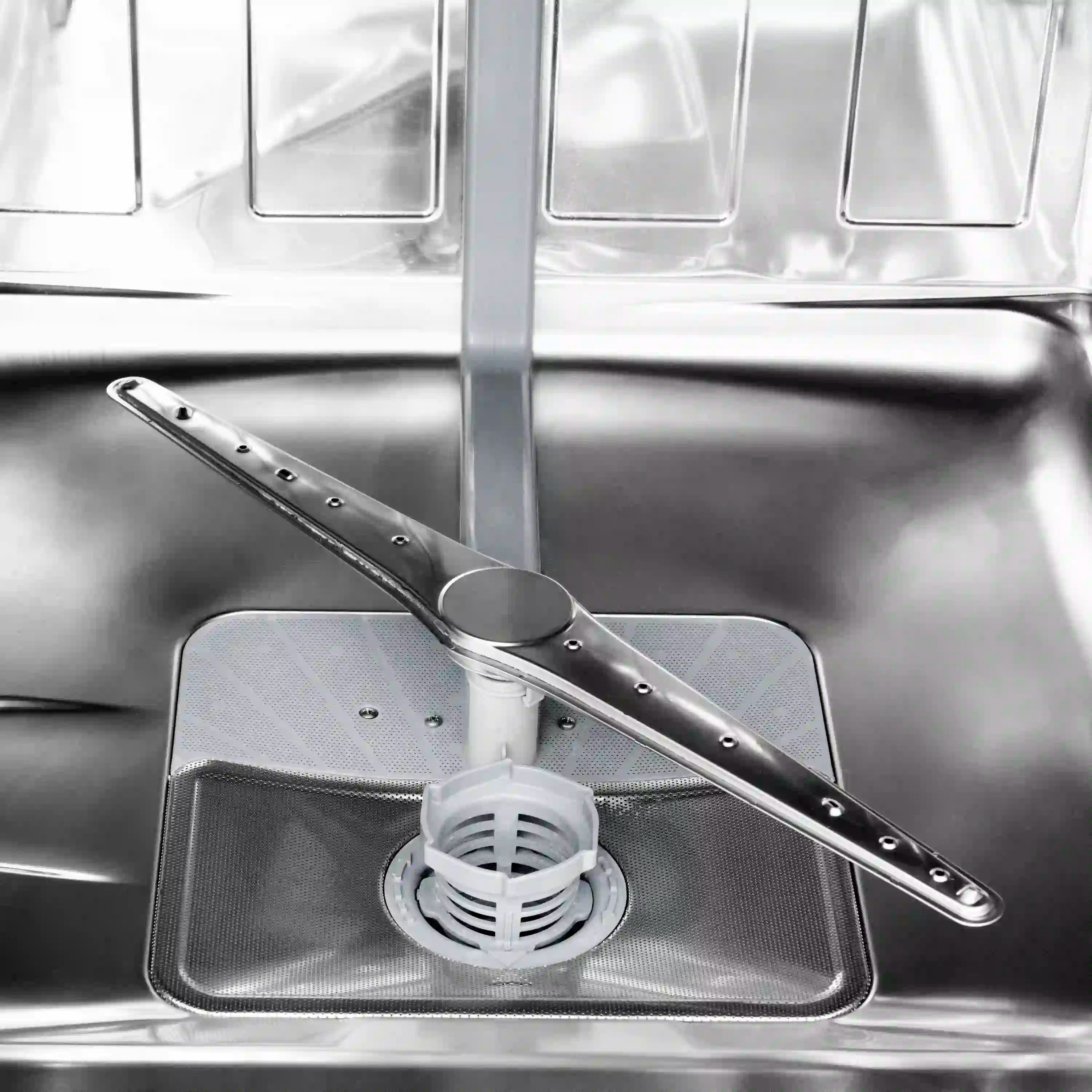 Stainless steel dishwasher tub with spray arm and drain filter
