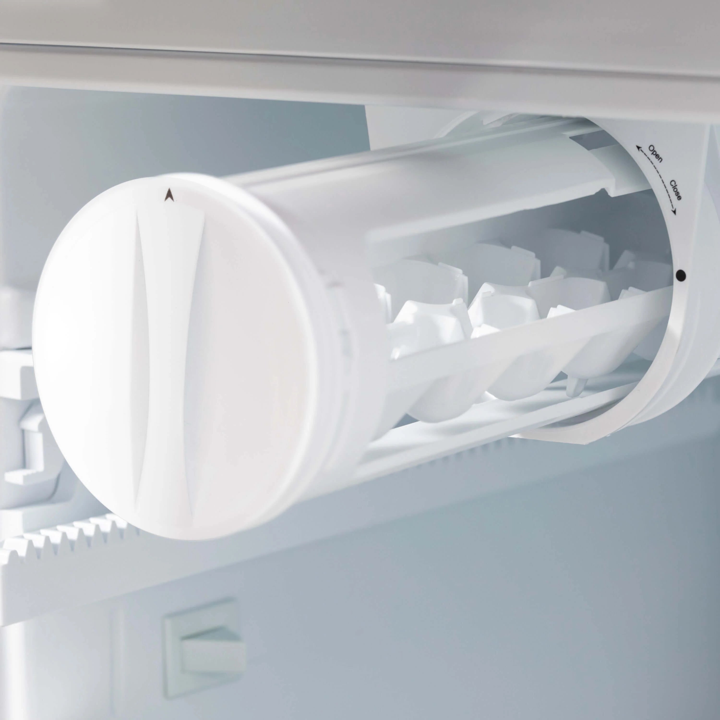 French door refrigerator ice maker chute with white ice bucket door