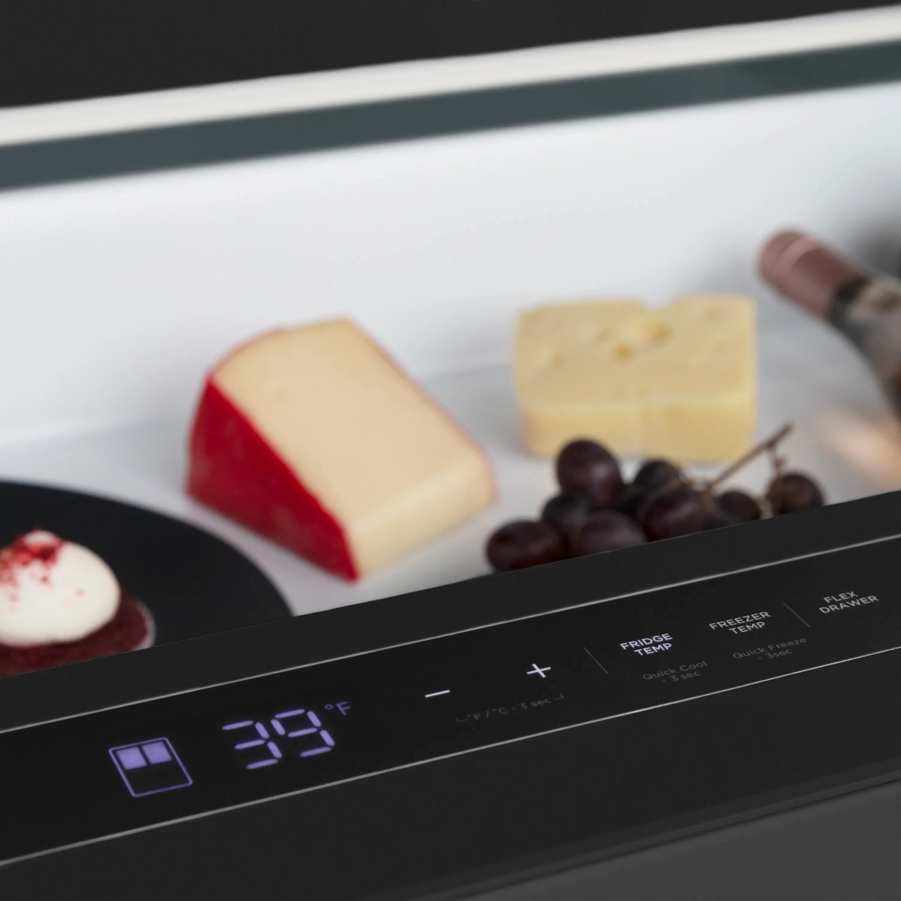 Black stainless steel refrigerator control panel with digital temperature display.