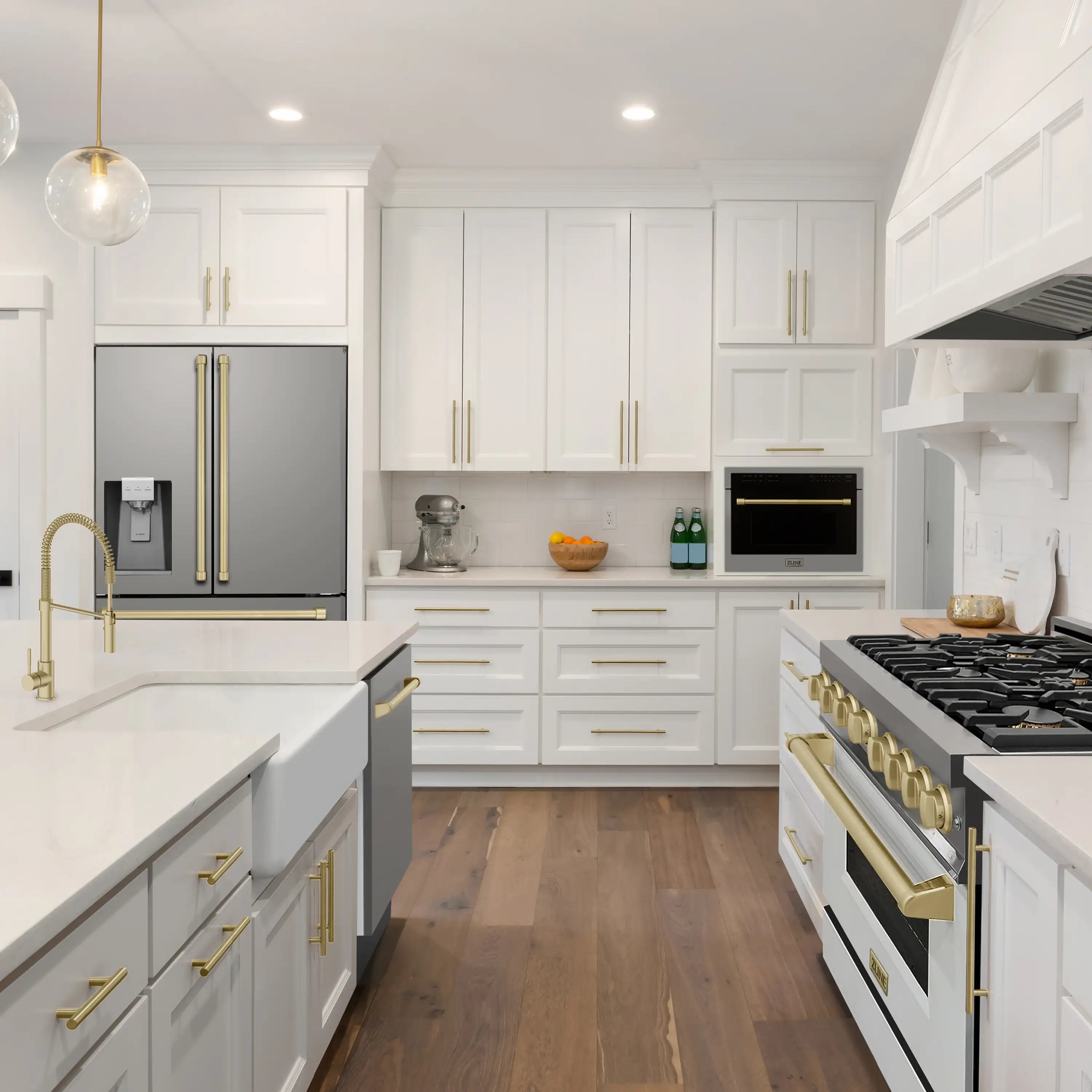Stainless steel French door refrigerator with gold handles installed in modern kitchen