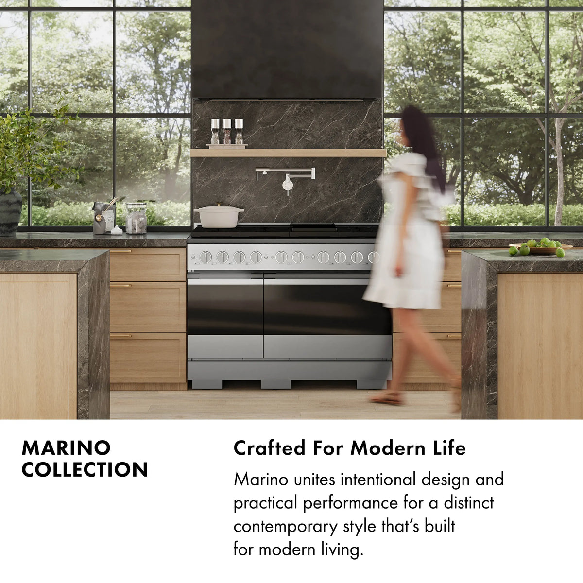 Black dual fuel range with champagne bronze control accents in a modern kitchen