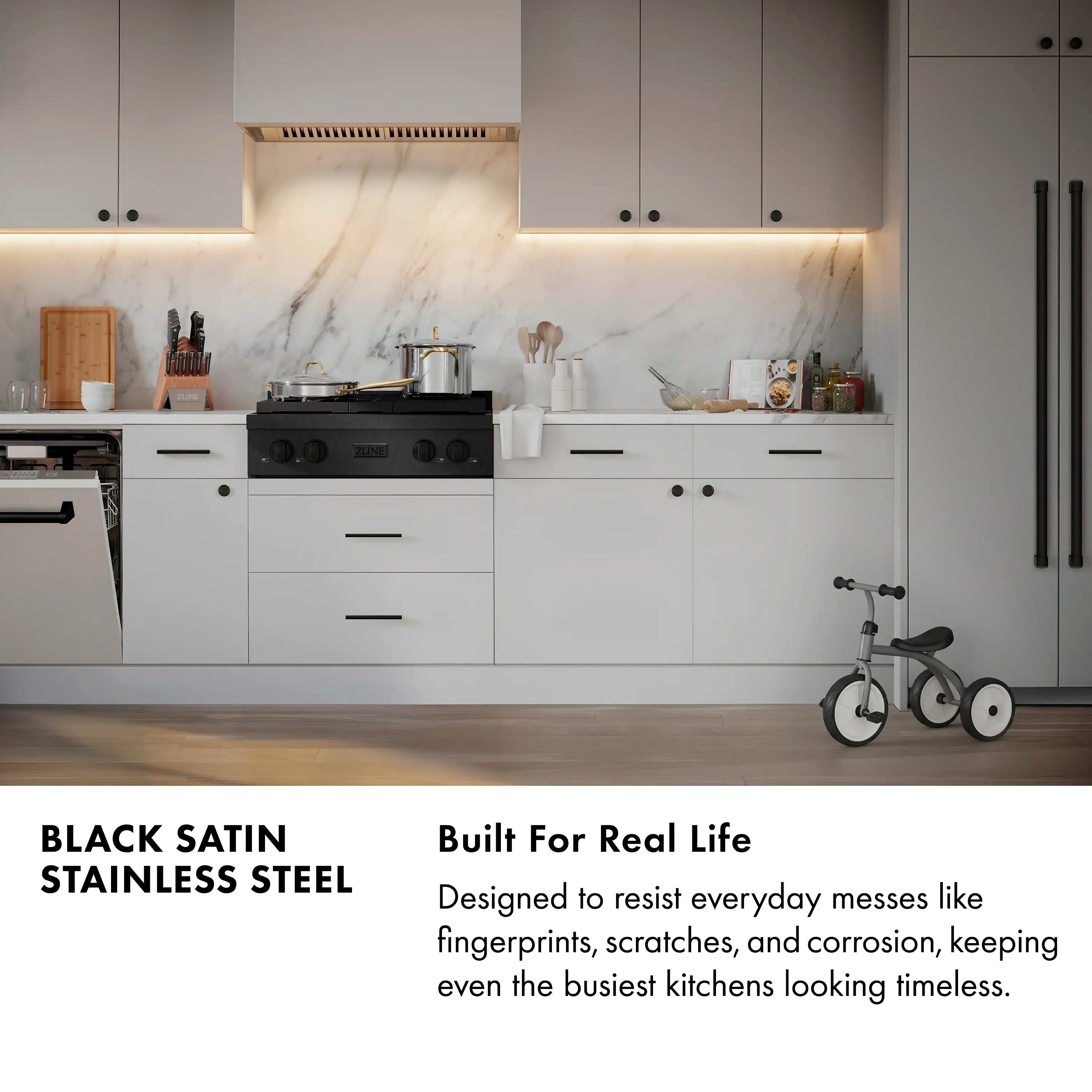 Black satin stainless steel gas cooktop with burner grates and control panel
