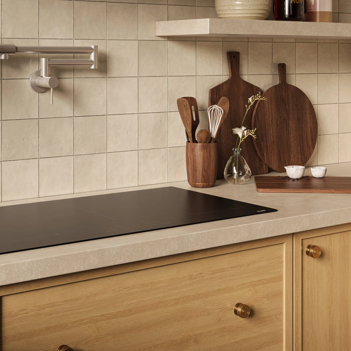 Built-in induction cooktop with dark glass cooking surface