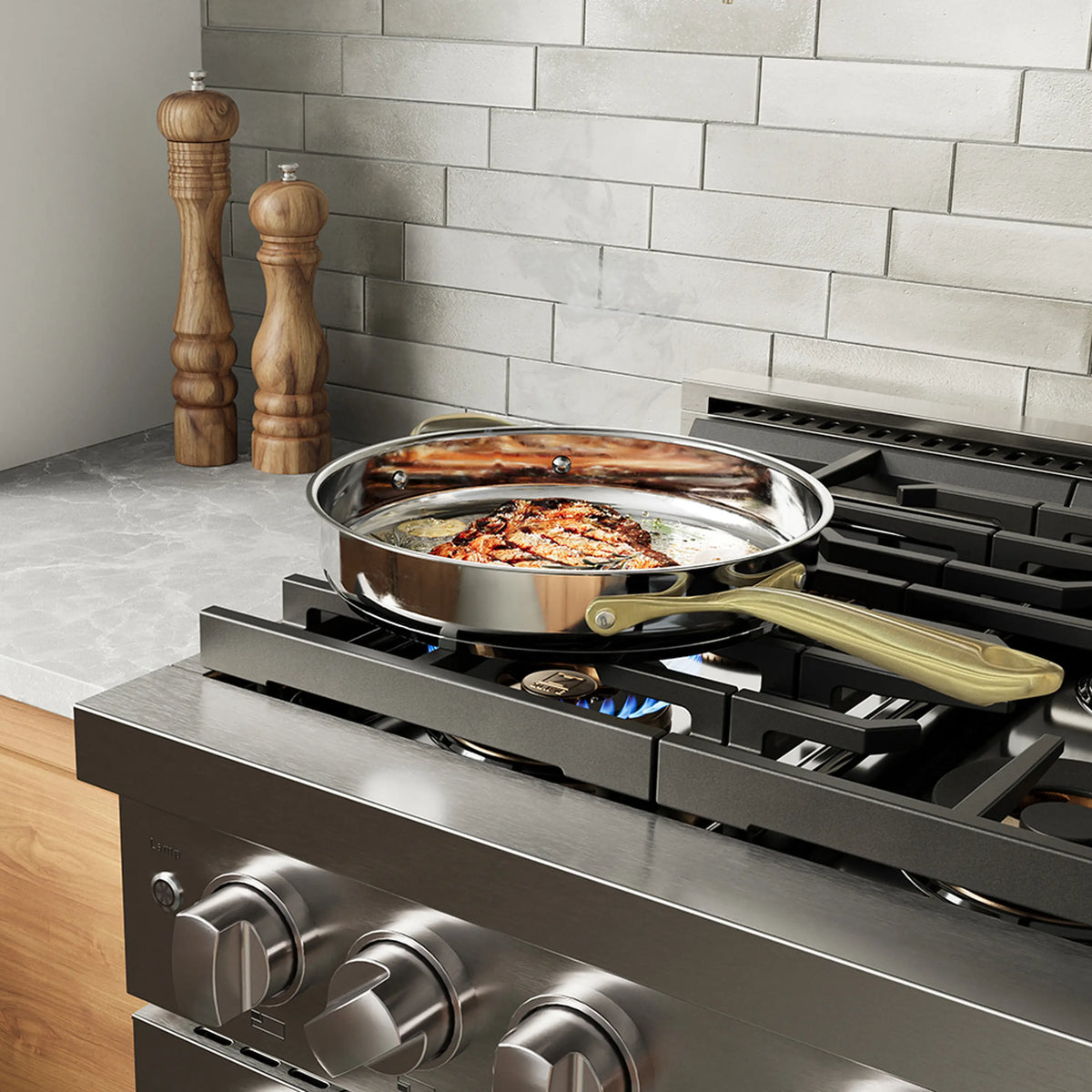 Stainless gas range cooktop with a pot heating on a burner