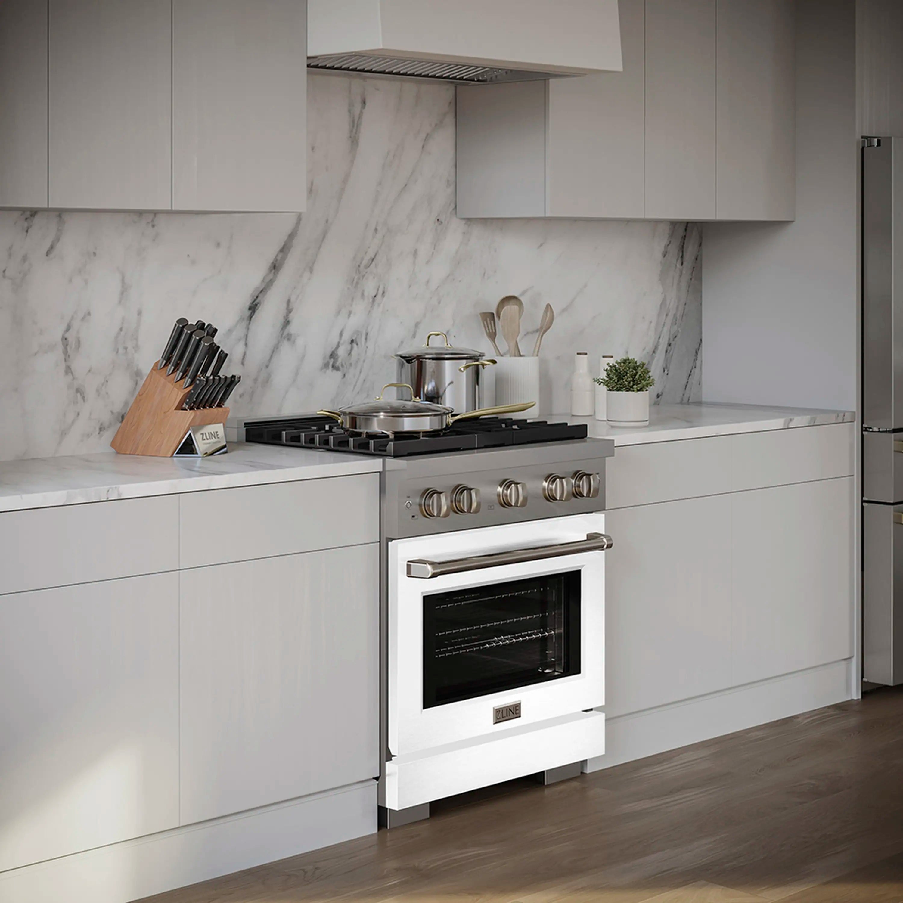 White matte dual fuel range with cooktop burners and glass oven door in modern kitchen