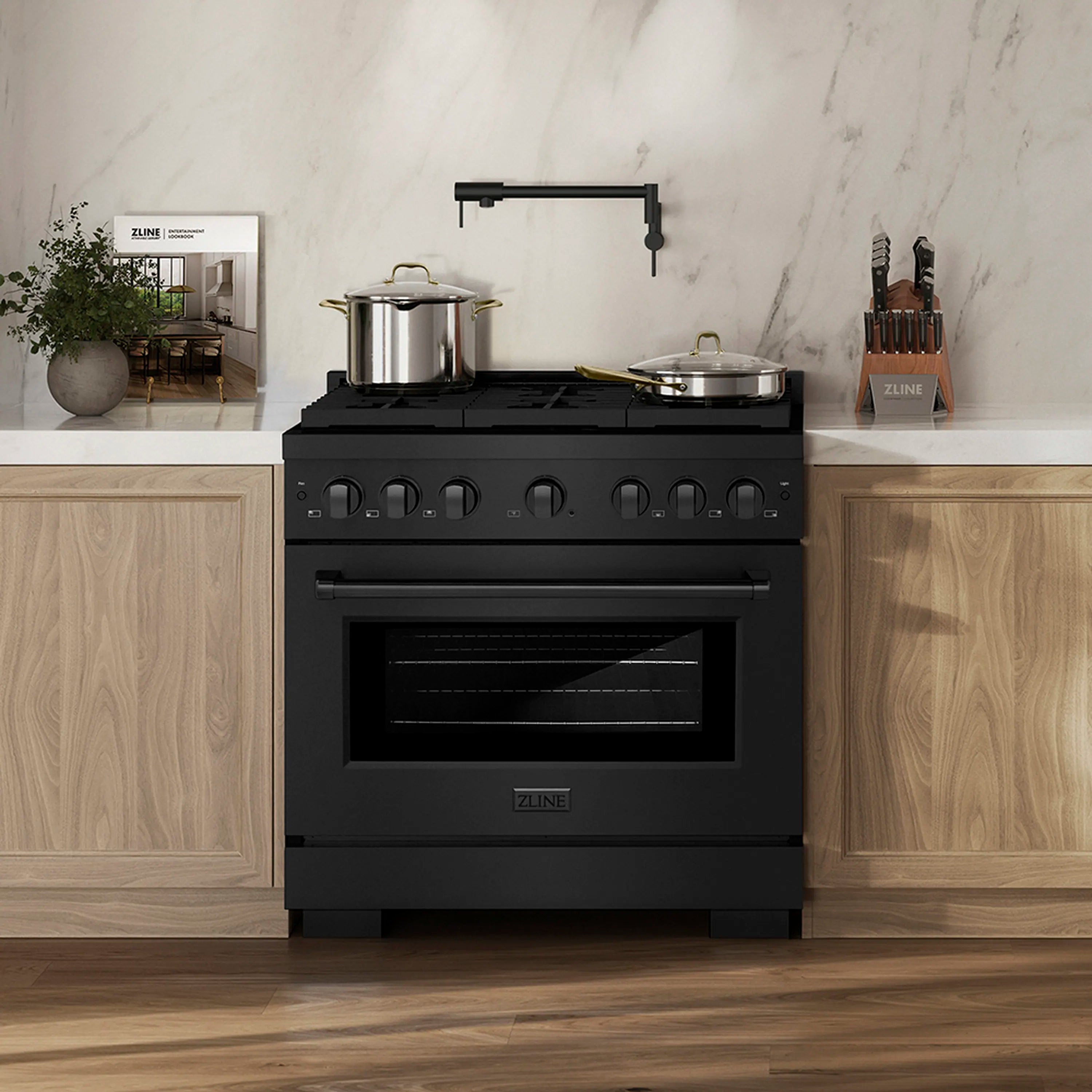 Black stainless gas range with oven door and control panel