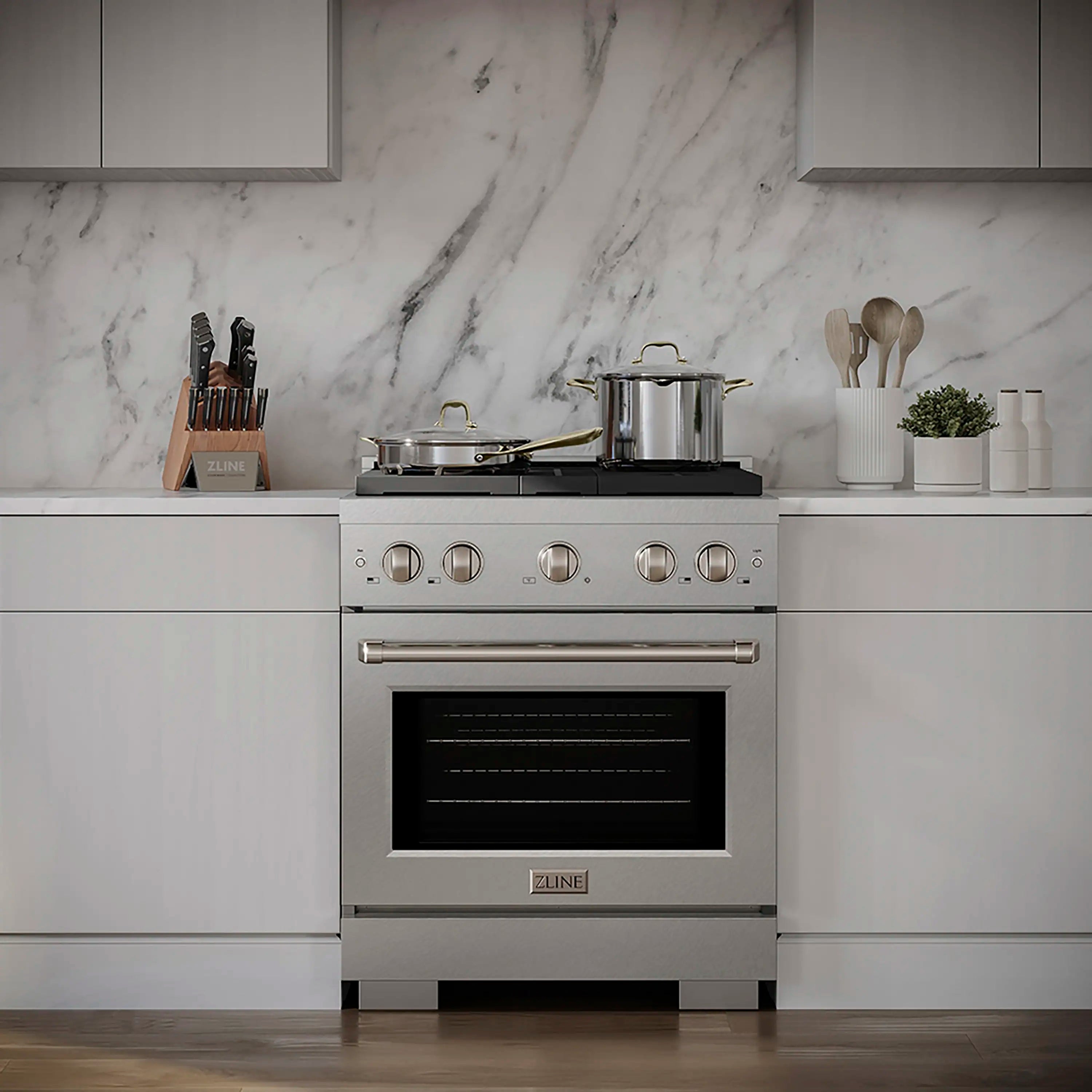 Front view of satin stainless gas range with four knobs, cooktop, and convection oven
