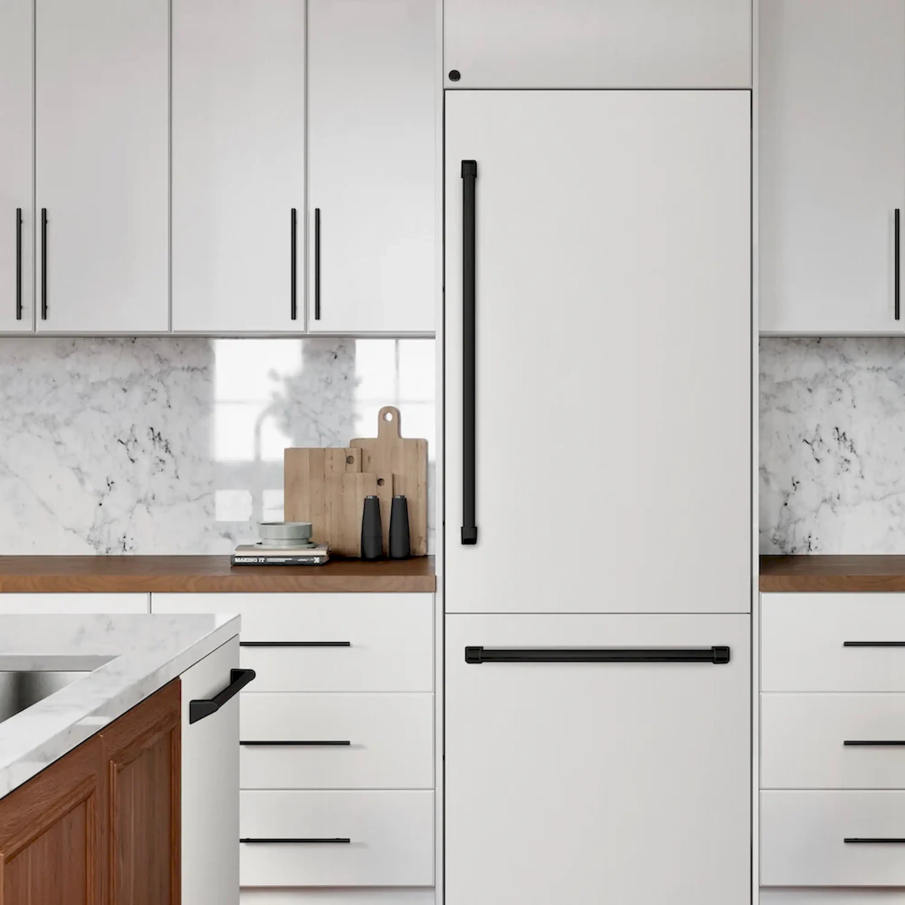 Built-in white refrigerator with matte black bar handles, installed in a kitchen