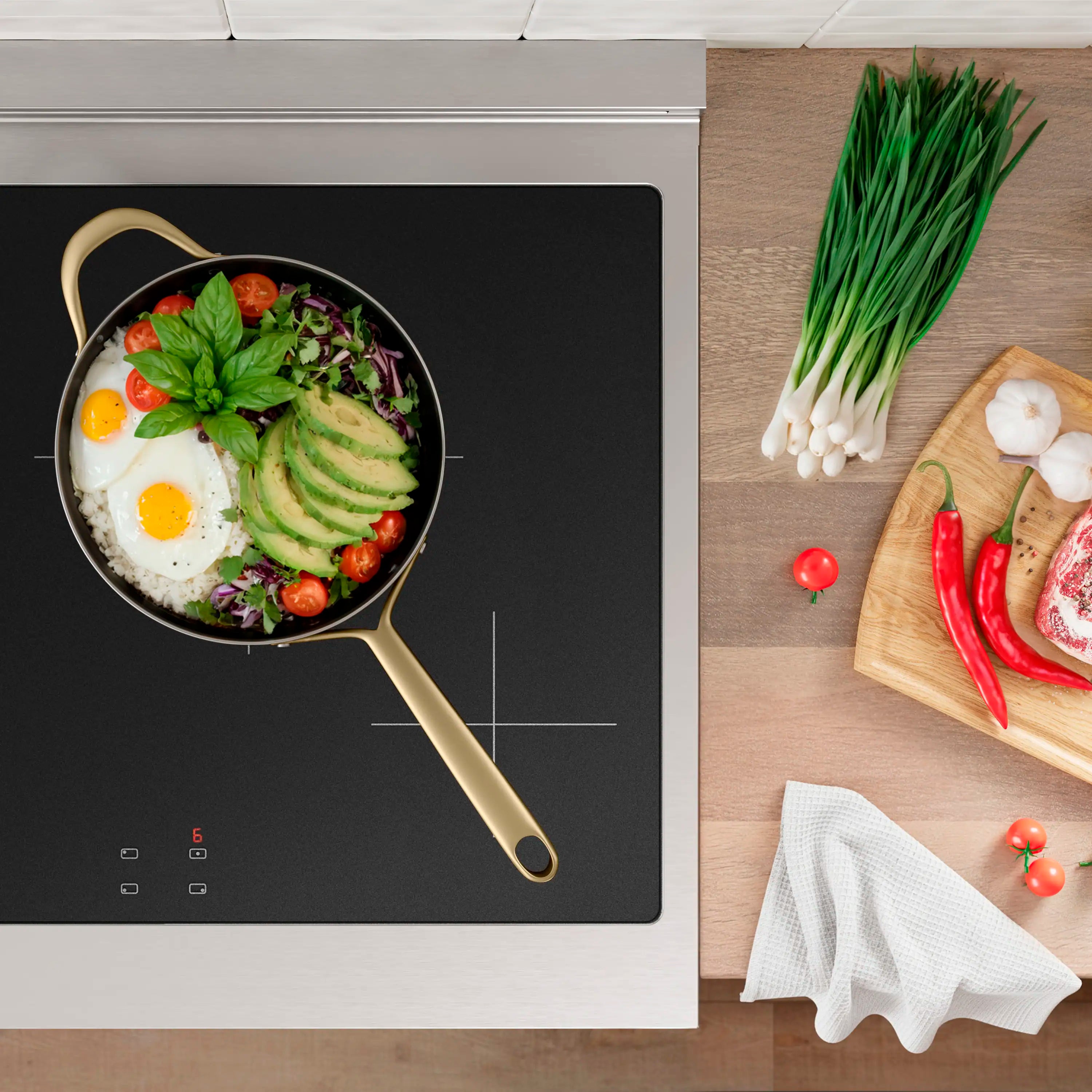 Black glass induction cooktop with skillet cooking surface and touch controls