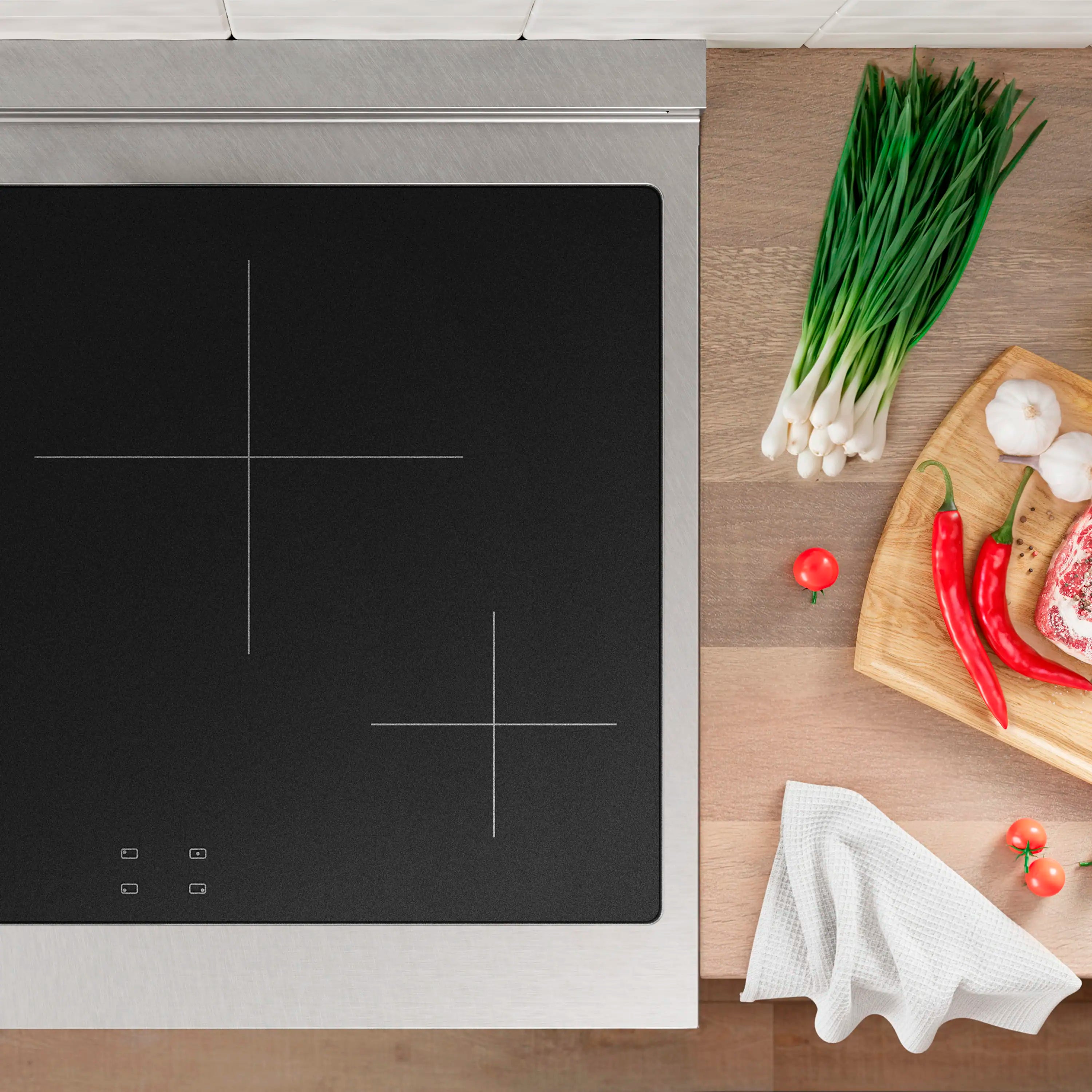 Induction cooktop with black glass center markings and satin stainless frame