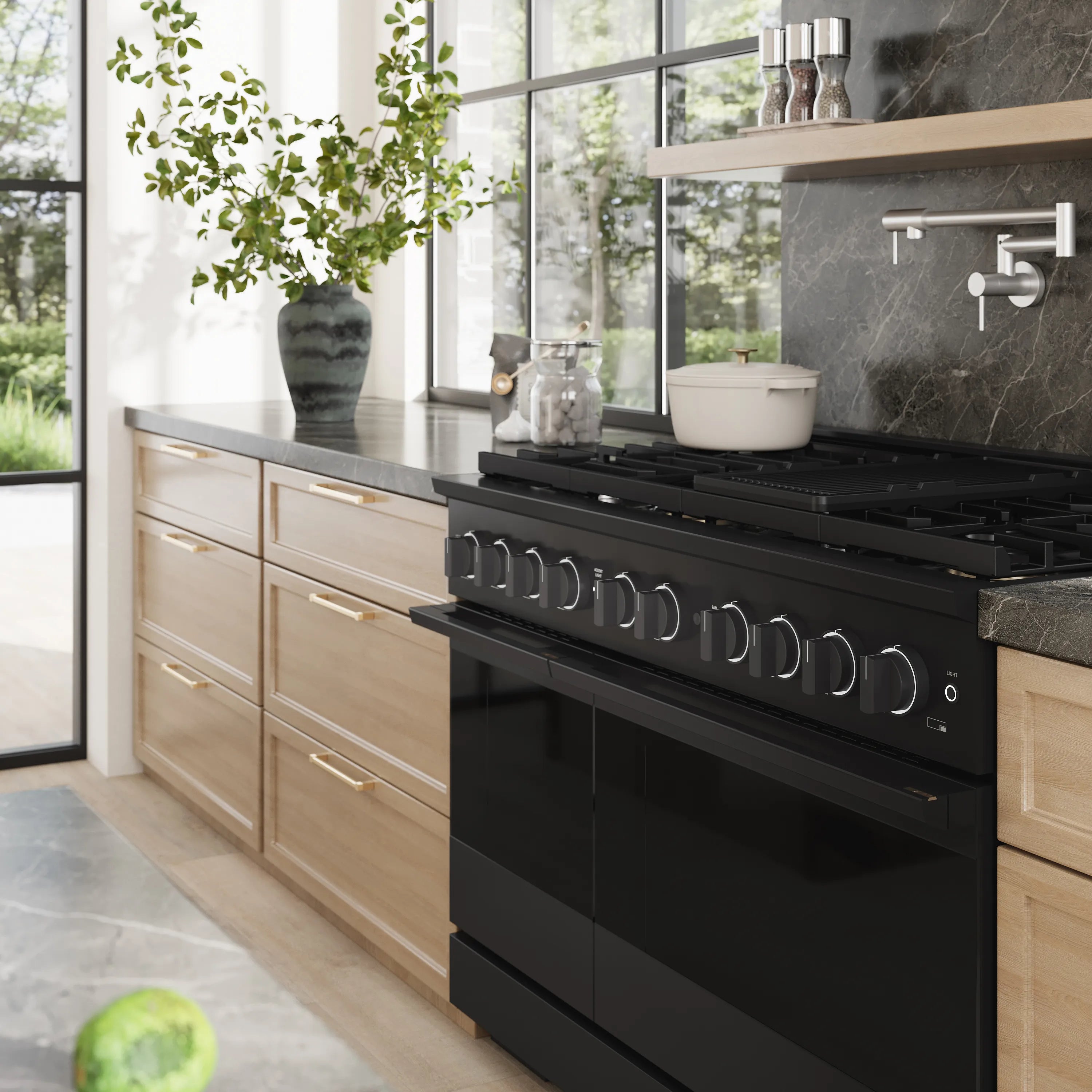 Black gas range cooktop with burner grates and control knobs in kitchen