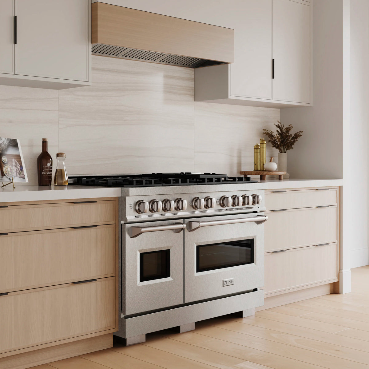Satin stainless steel dual fuel range with dual ovens and multiple burner grates