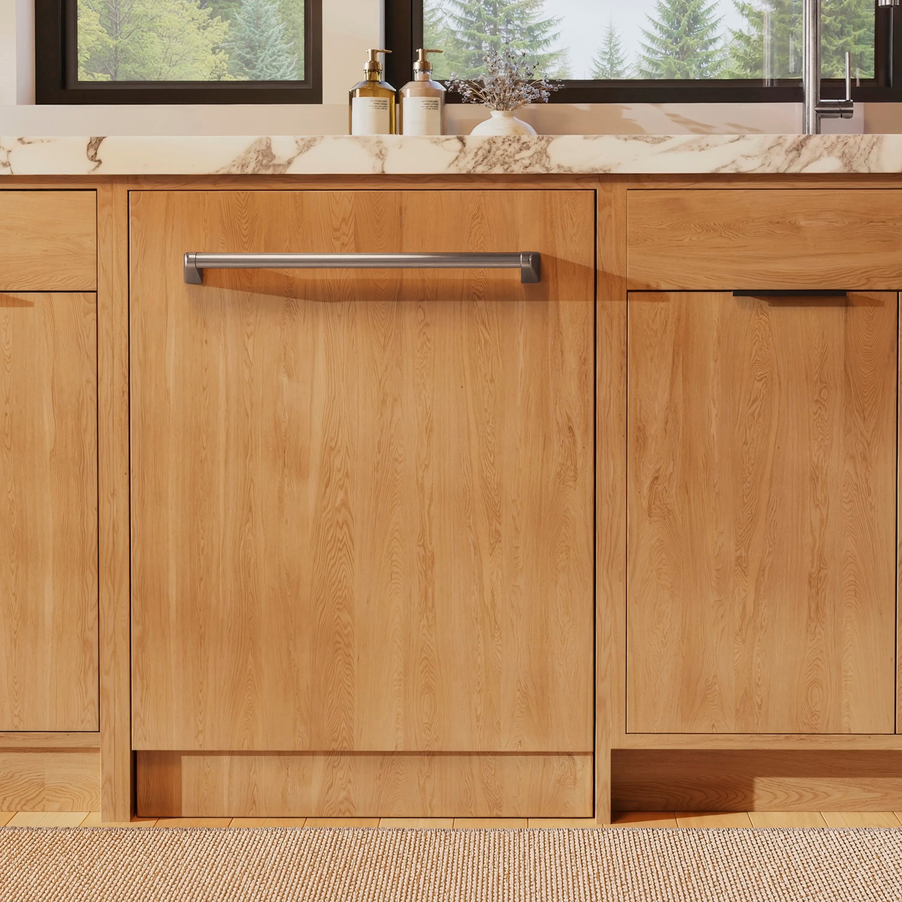 Built-in 24-inch dishwasher with wood front panel installed under a countertop