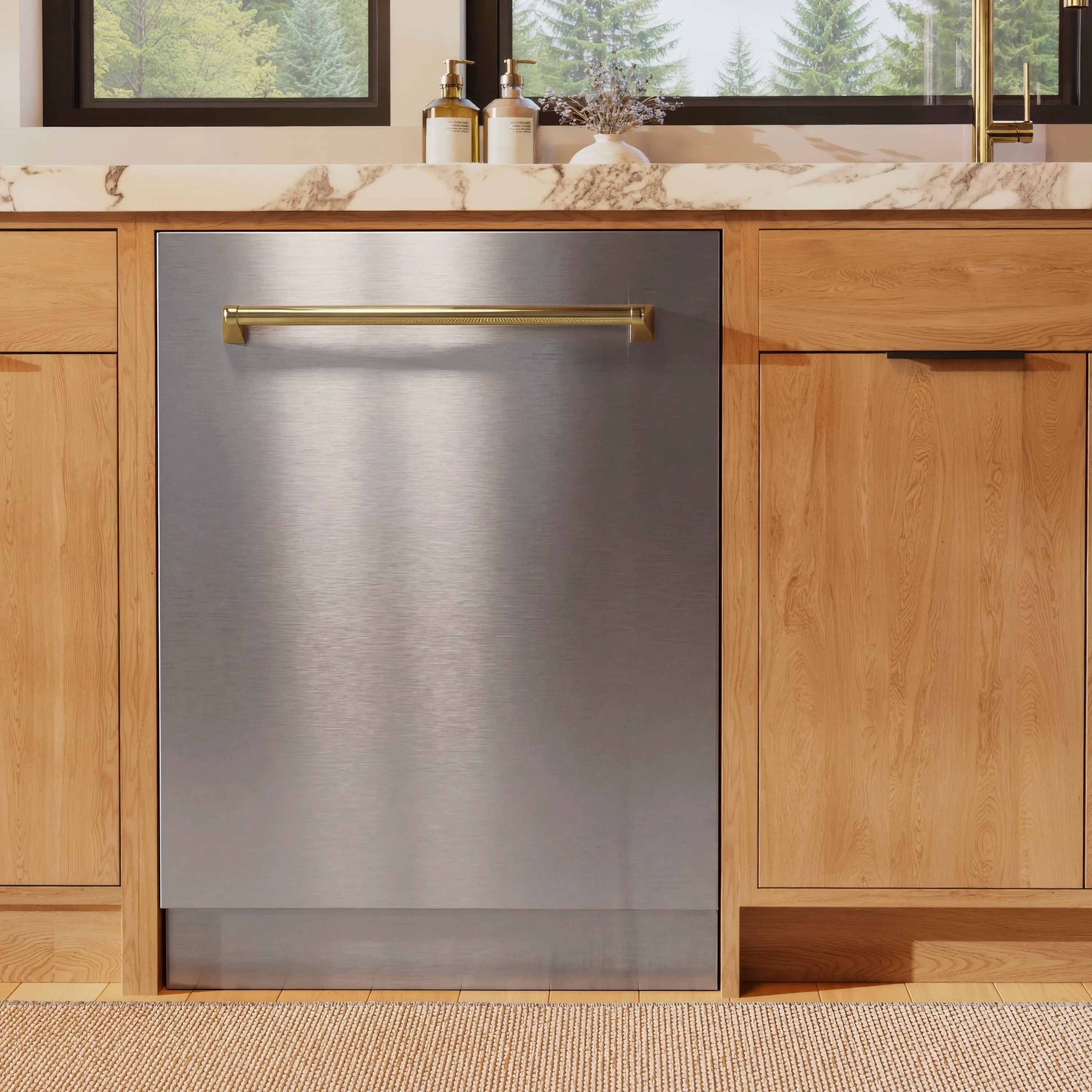 Brushed stainless steel dishwasher door with gold bar handle