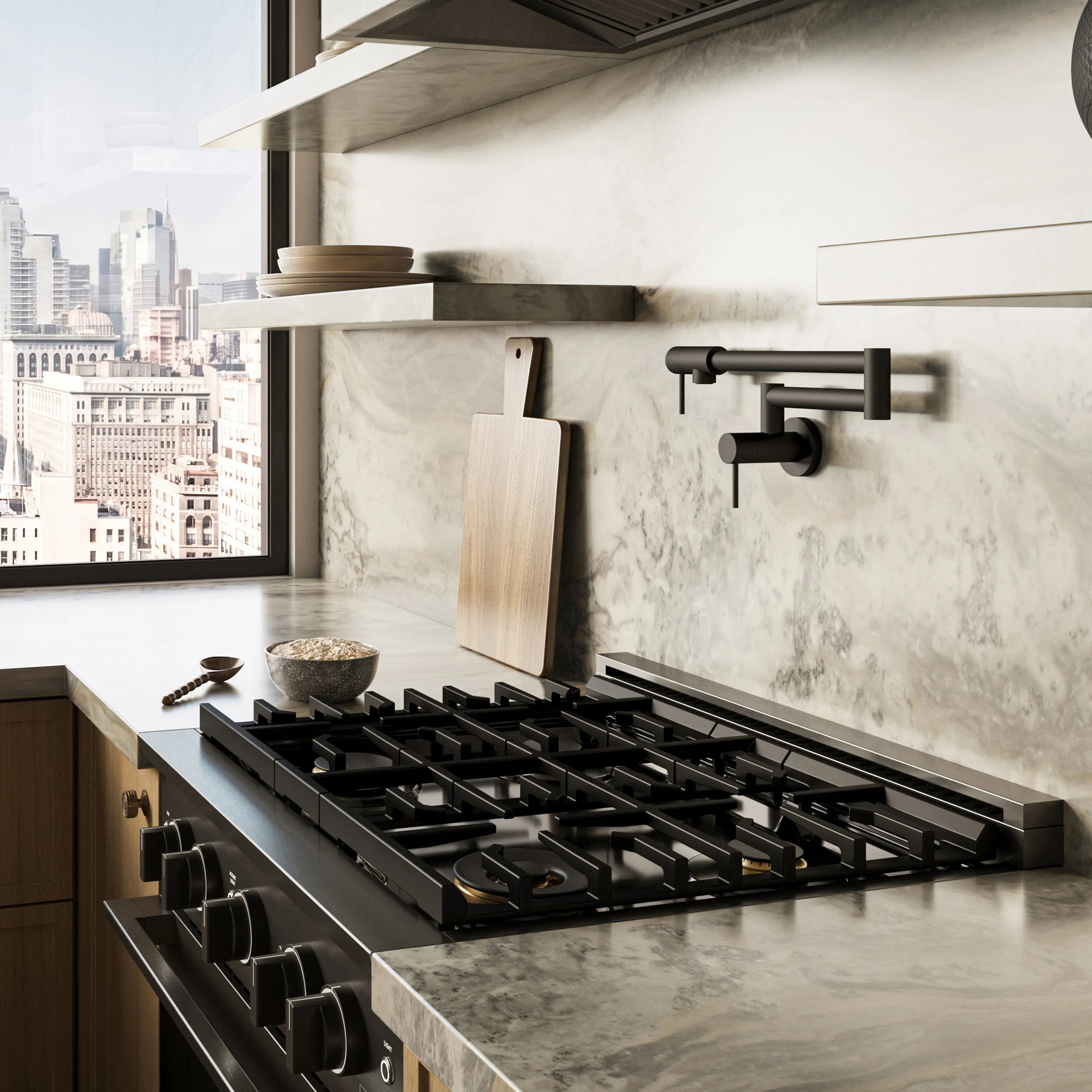 Black stainless gas cooktop range with multiple burners in a modern kitchen setup