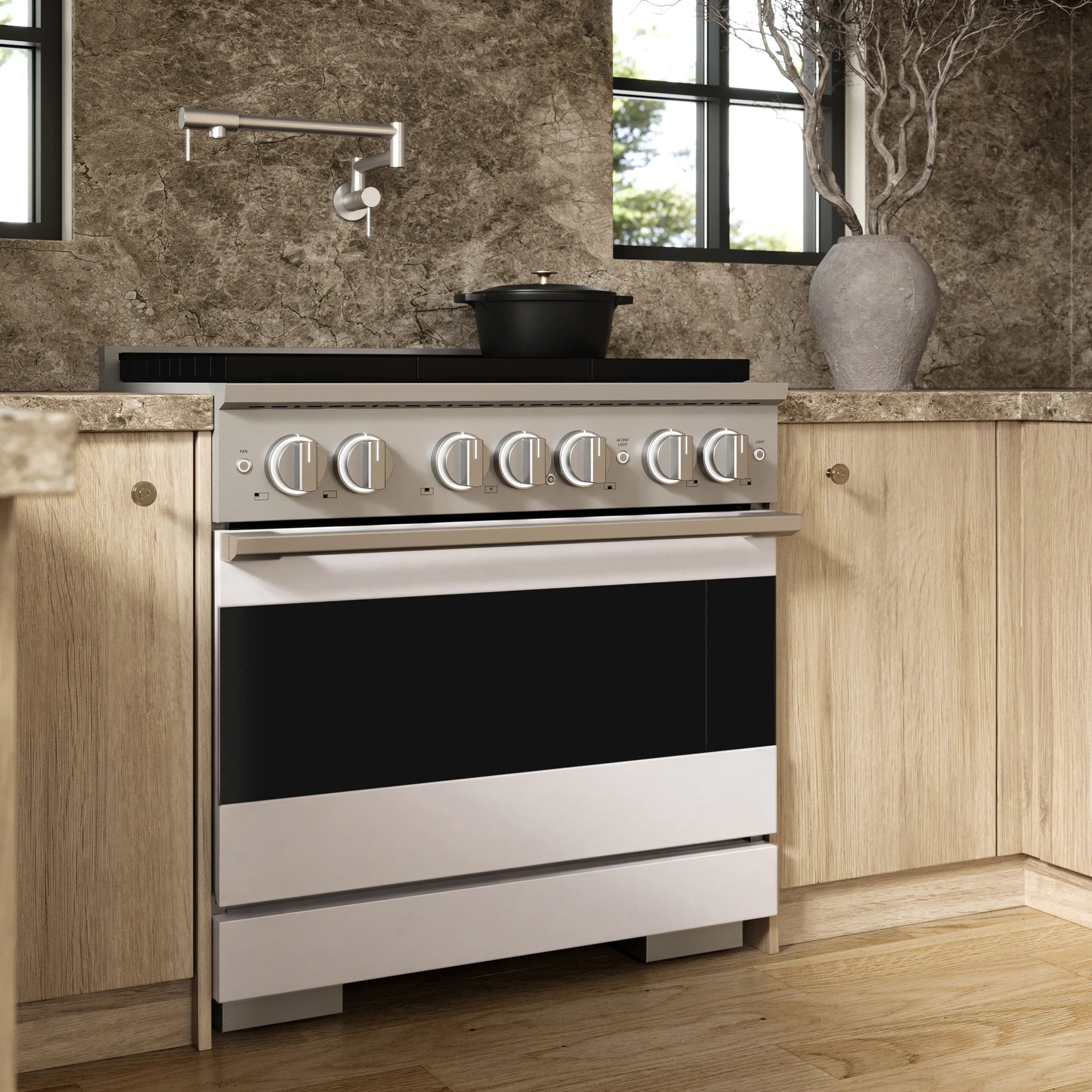 Stainless steel gas range with control knobs and oven drawer front in kitchen