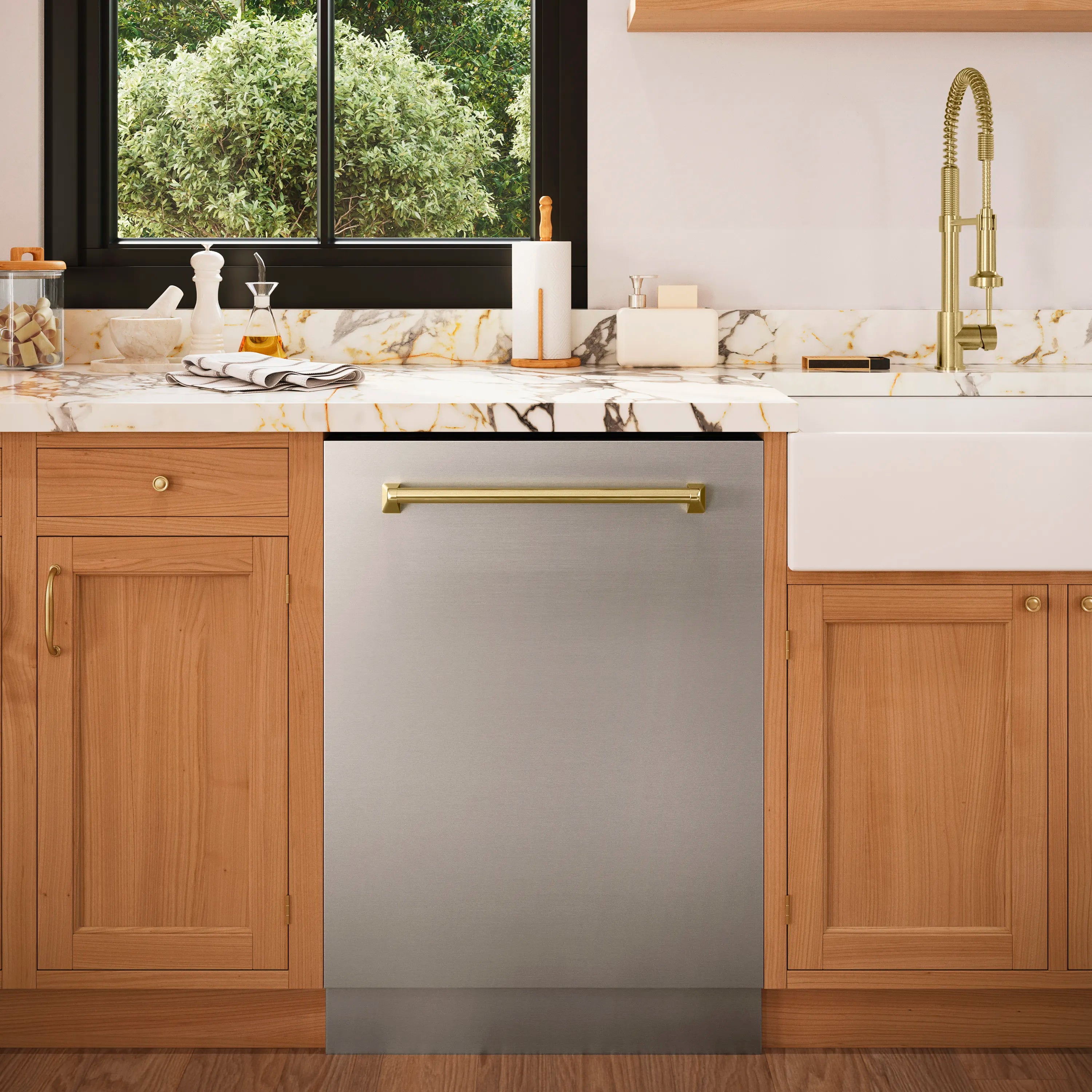 Built-in stainless dishwasher with long bronze handle in kitchen cabinet opening