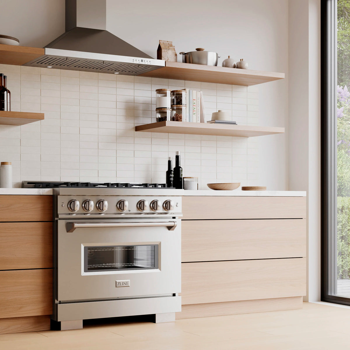 Stainless steel gas range with windowed oven and control knobs