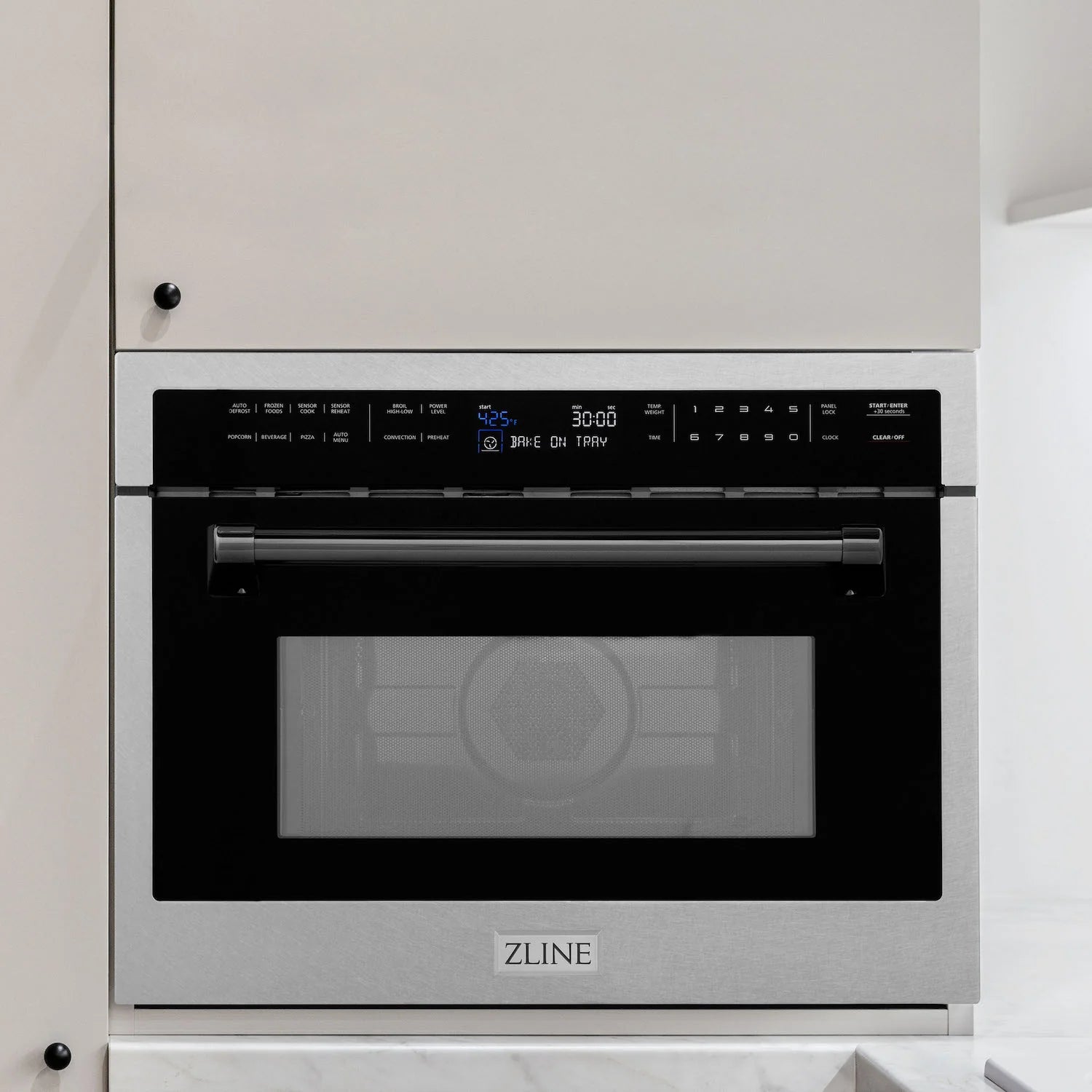 24-inch microwave oven with satin stainless steel frame and matte black door accents