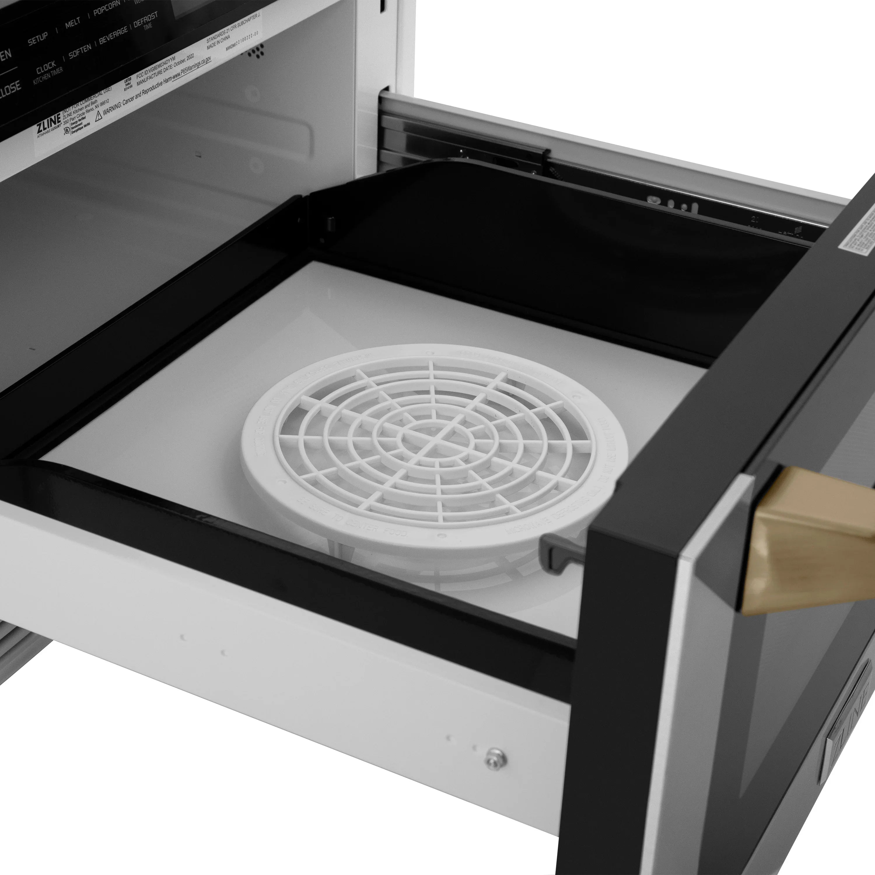 Stainless steel microwave drawer with turntable plate inside and champagne bronze handle