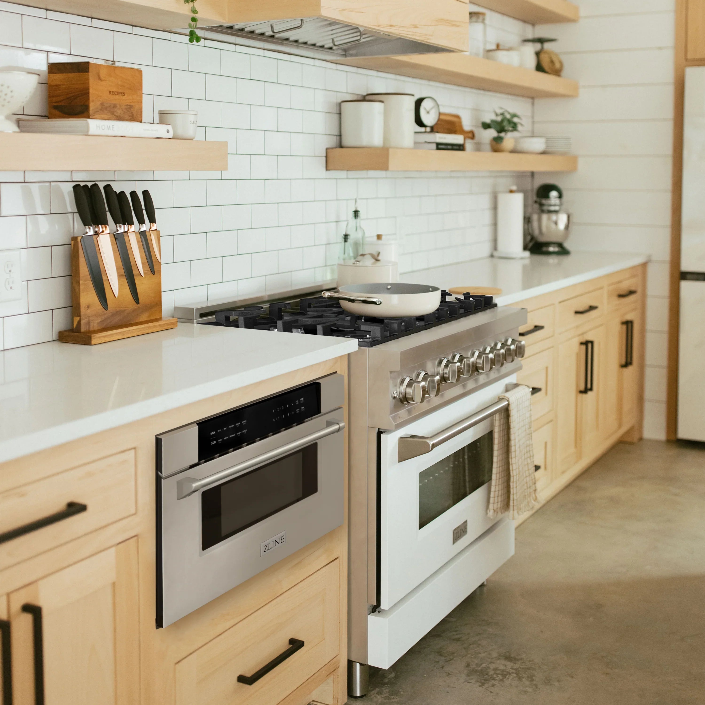 Stainless steel dual-fuel range with two oven doors and front control panel