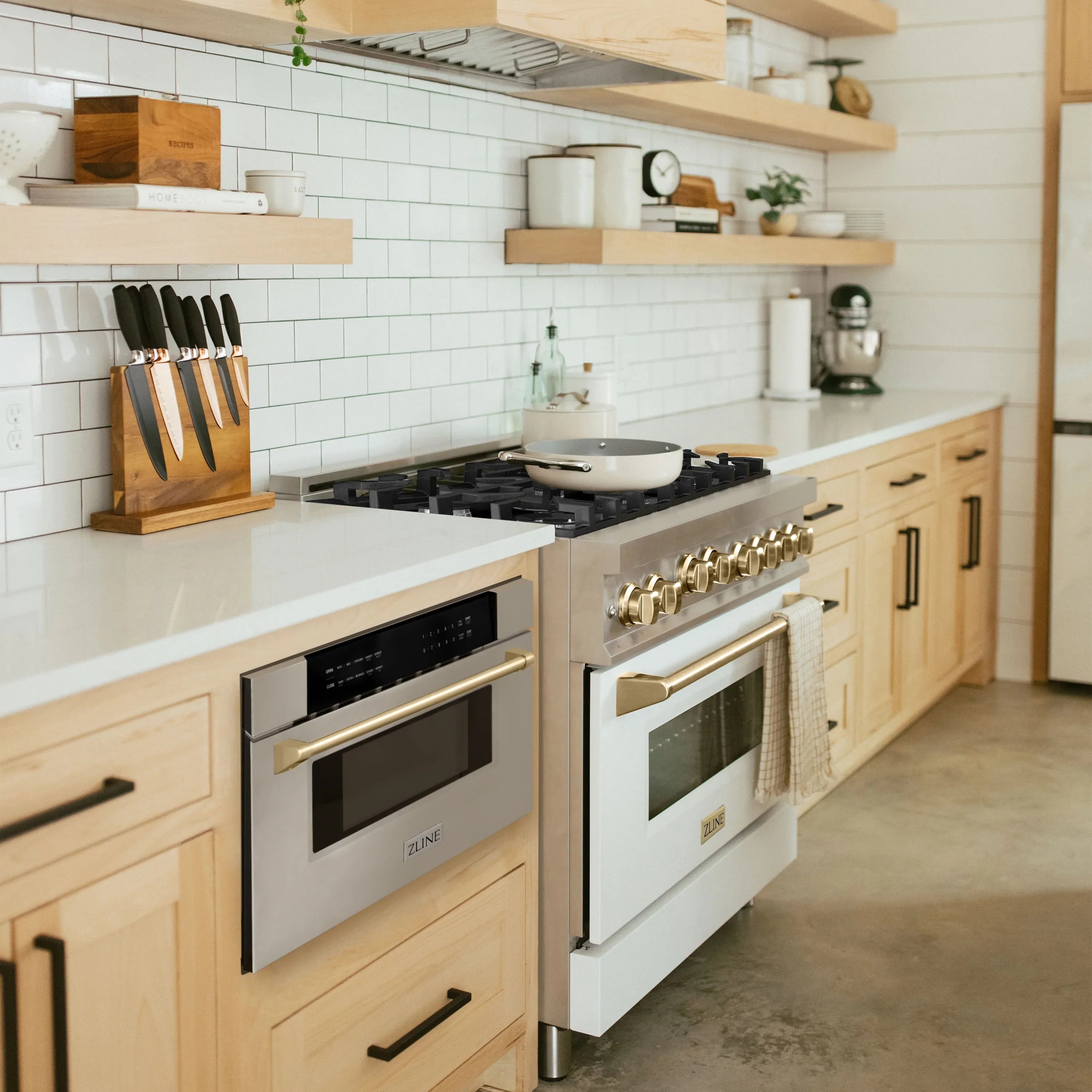 Kitchen appliance package in stainless steel with gas range and built-in dishwasher