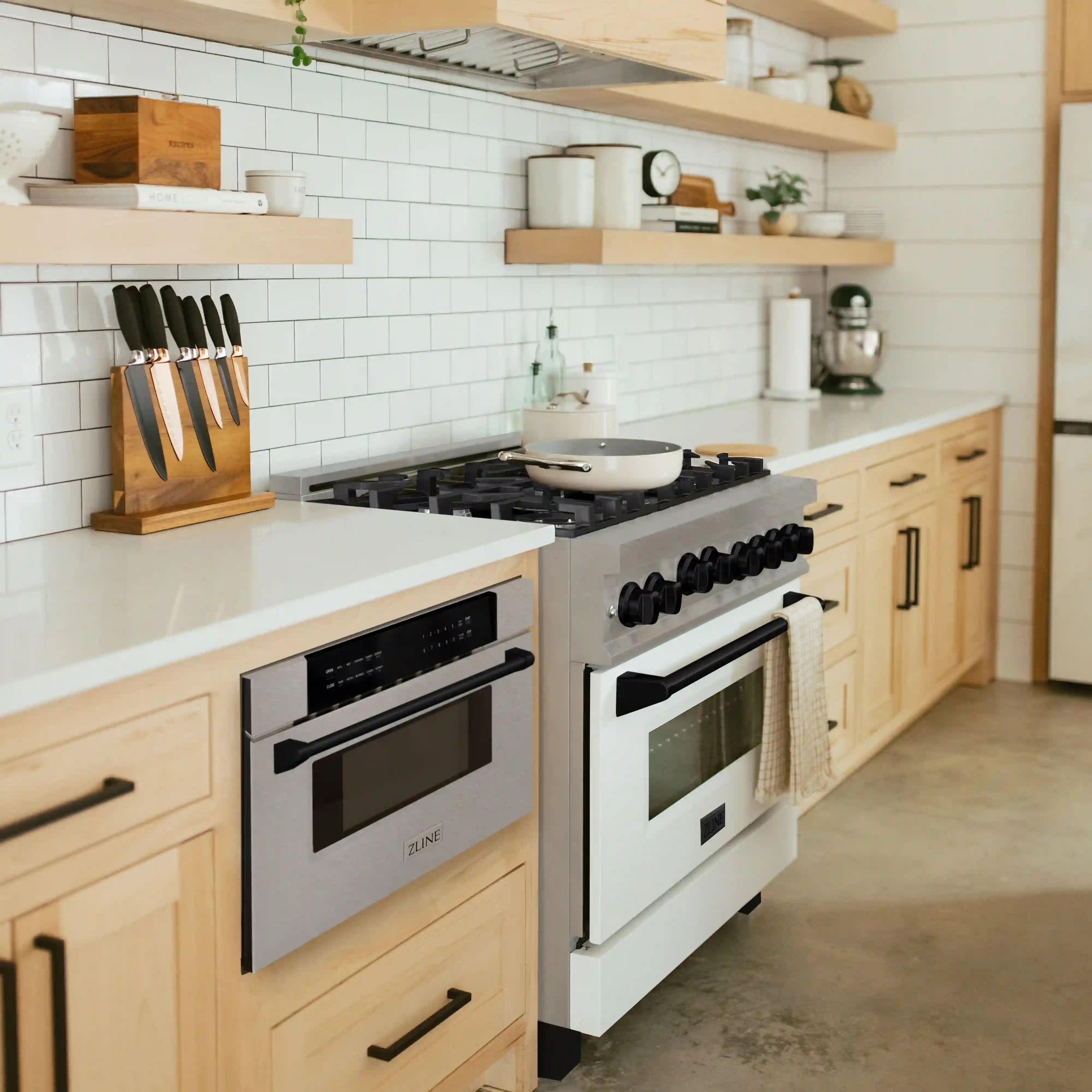 Installed built-in microwave drawer in satin stainless steel with matte black accents