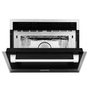 Built-in stainless microwave oven with front open and turntable inside
