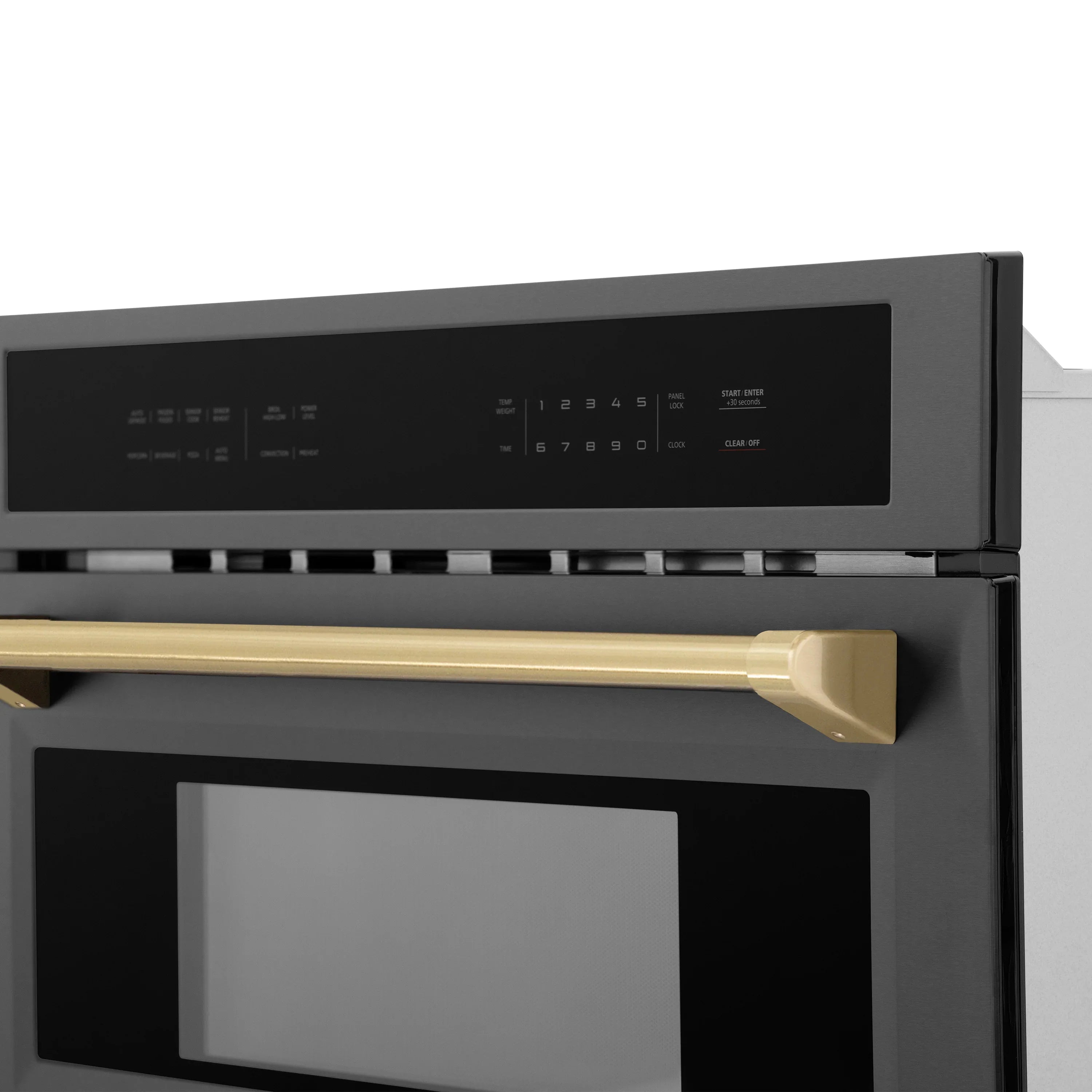 Black stainless steel oven control panel and champagne bronze handle trim close-up