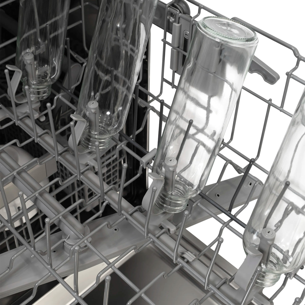 Dishwasher interior with tall glasses and stemware arranged in wire rack tines