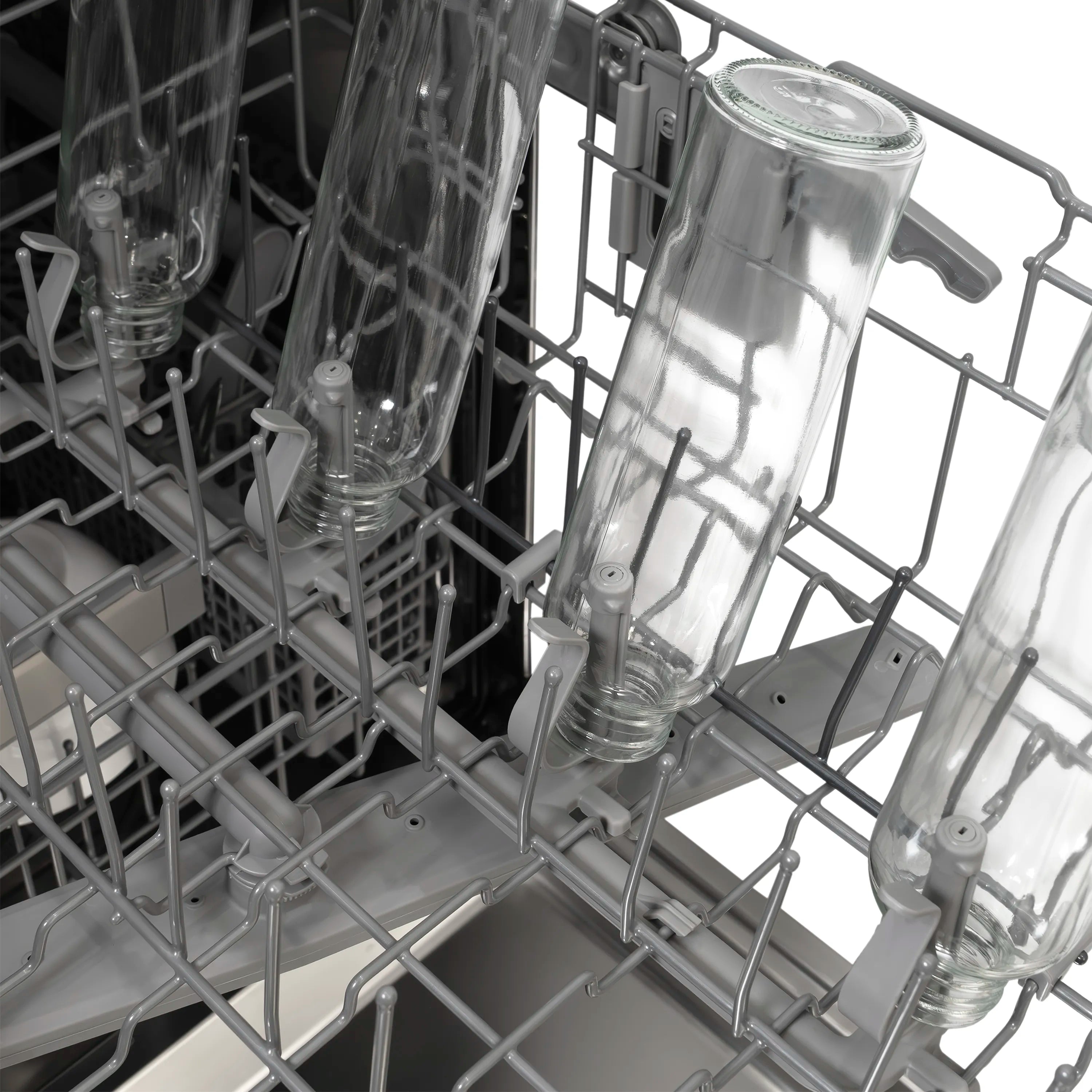Dishwasher upper rack loaded with clear glasses and connected spray jets