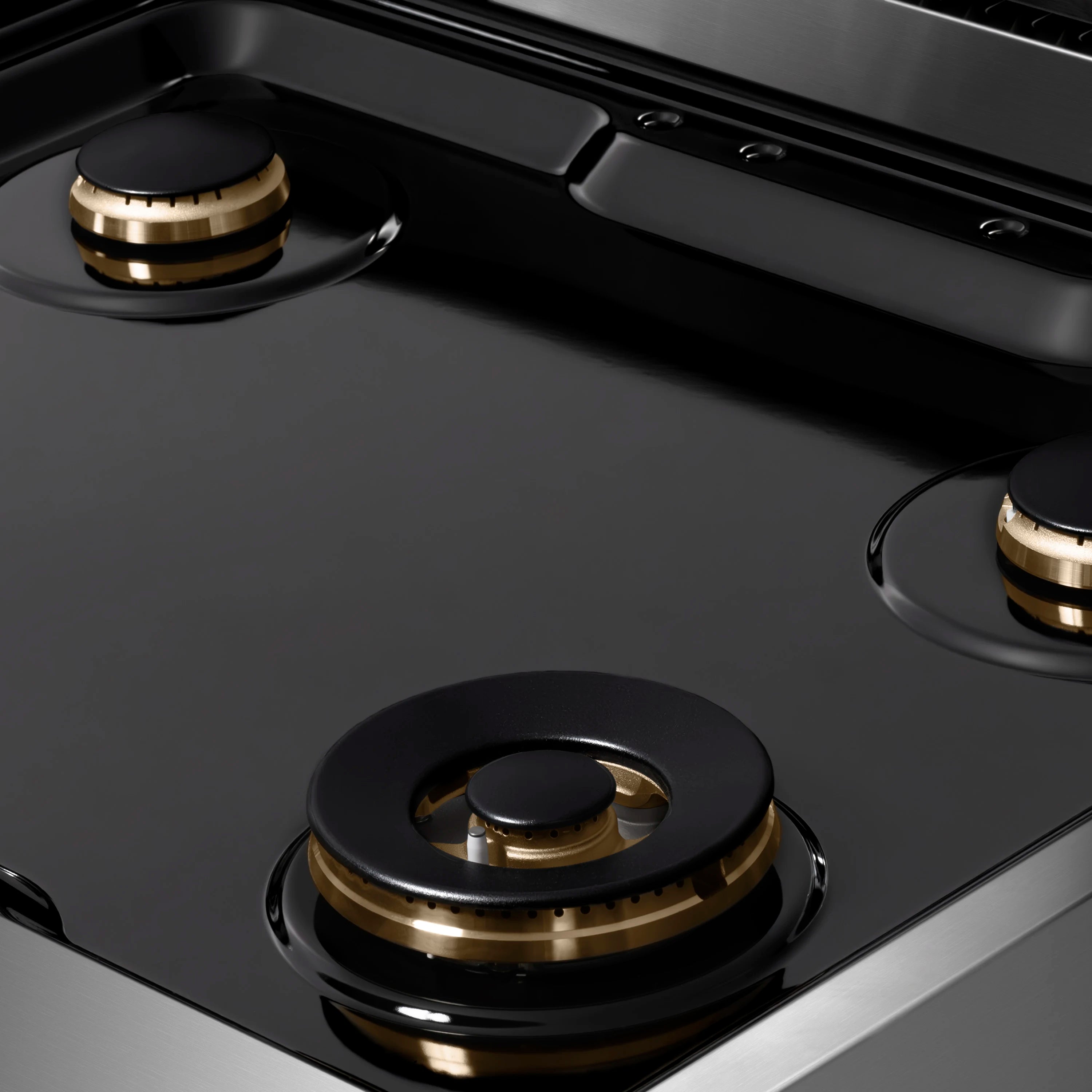 Stainless steel 4-burner gas rangetop with black porcelain cooktop and champagne bronze accents