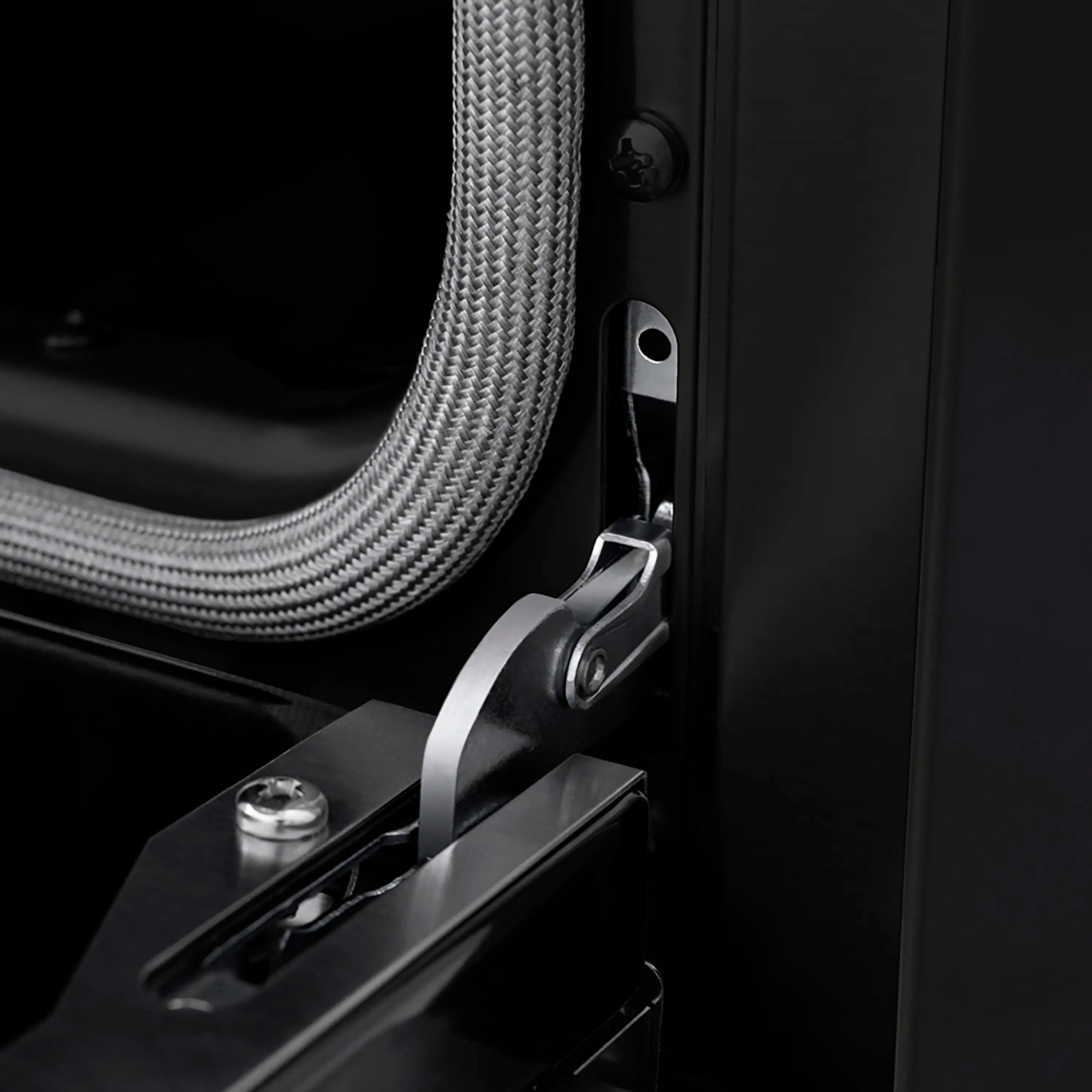 Side connection area with braided hose and metal lever on black range