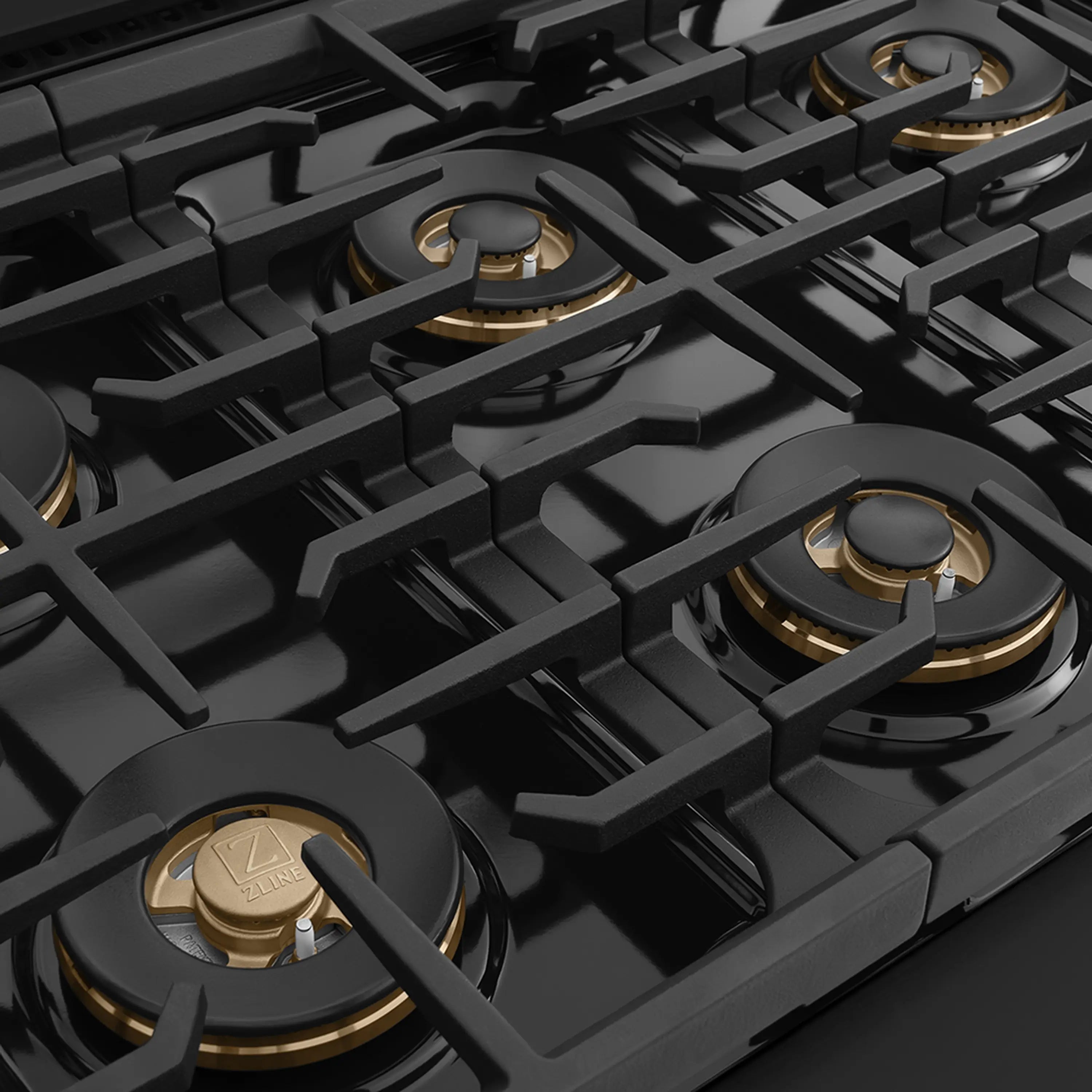 Gas cooktop with multiple burner caps and black cast grates