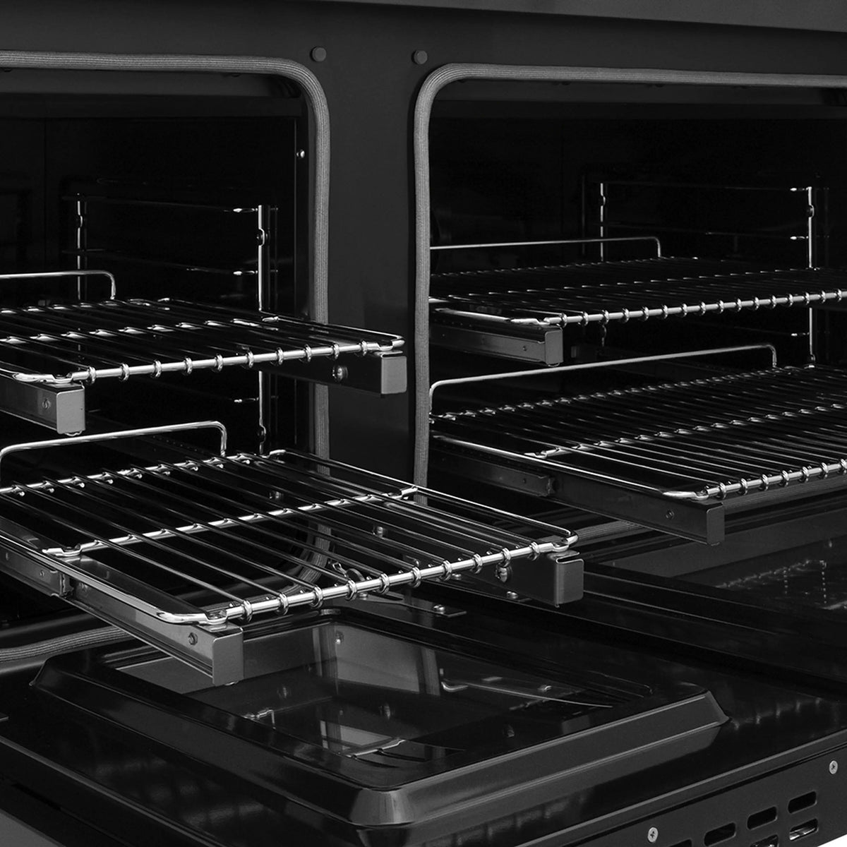Open oven with two racks, black interior, and chrome rail supports