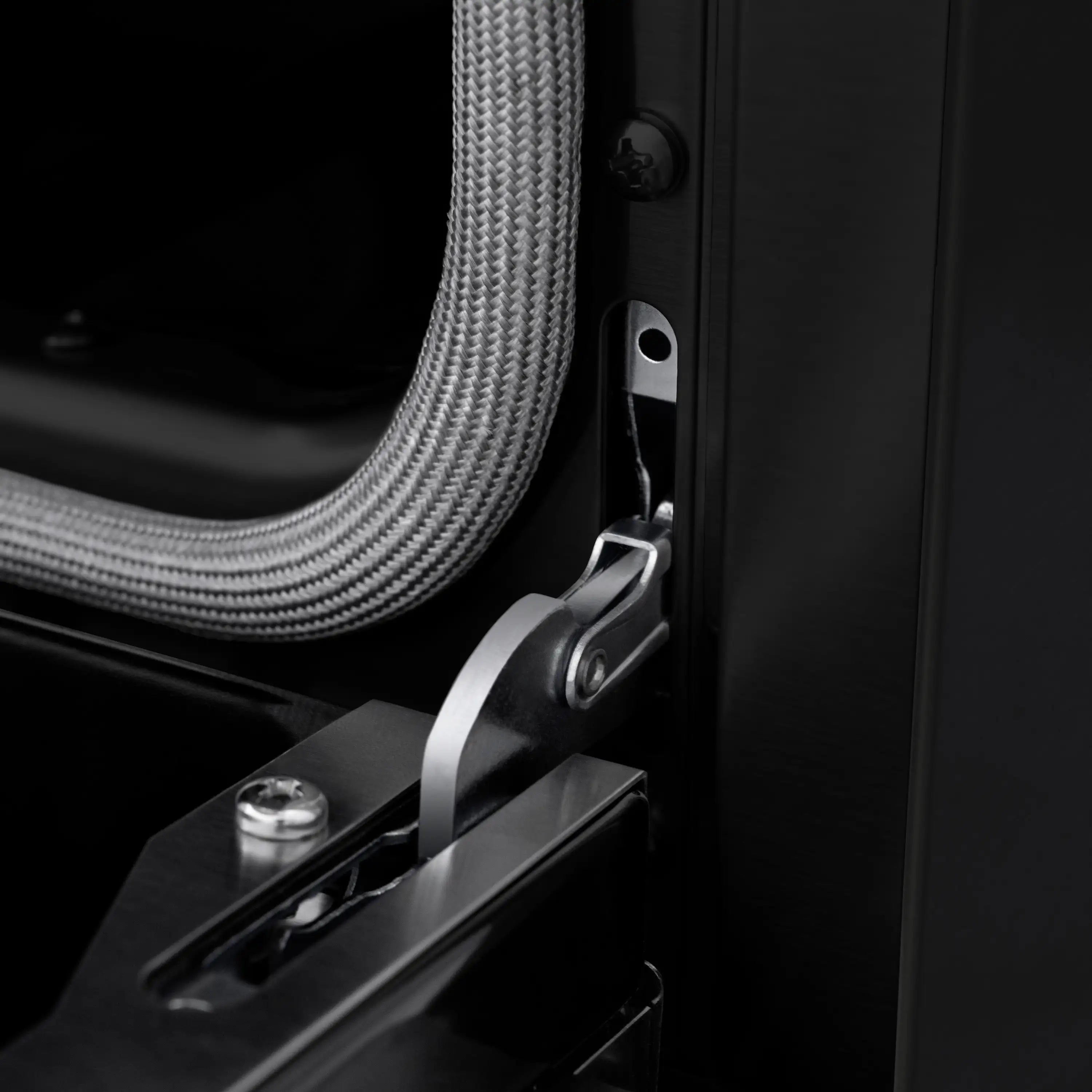 Black range door latch and handle with braided power cord
