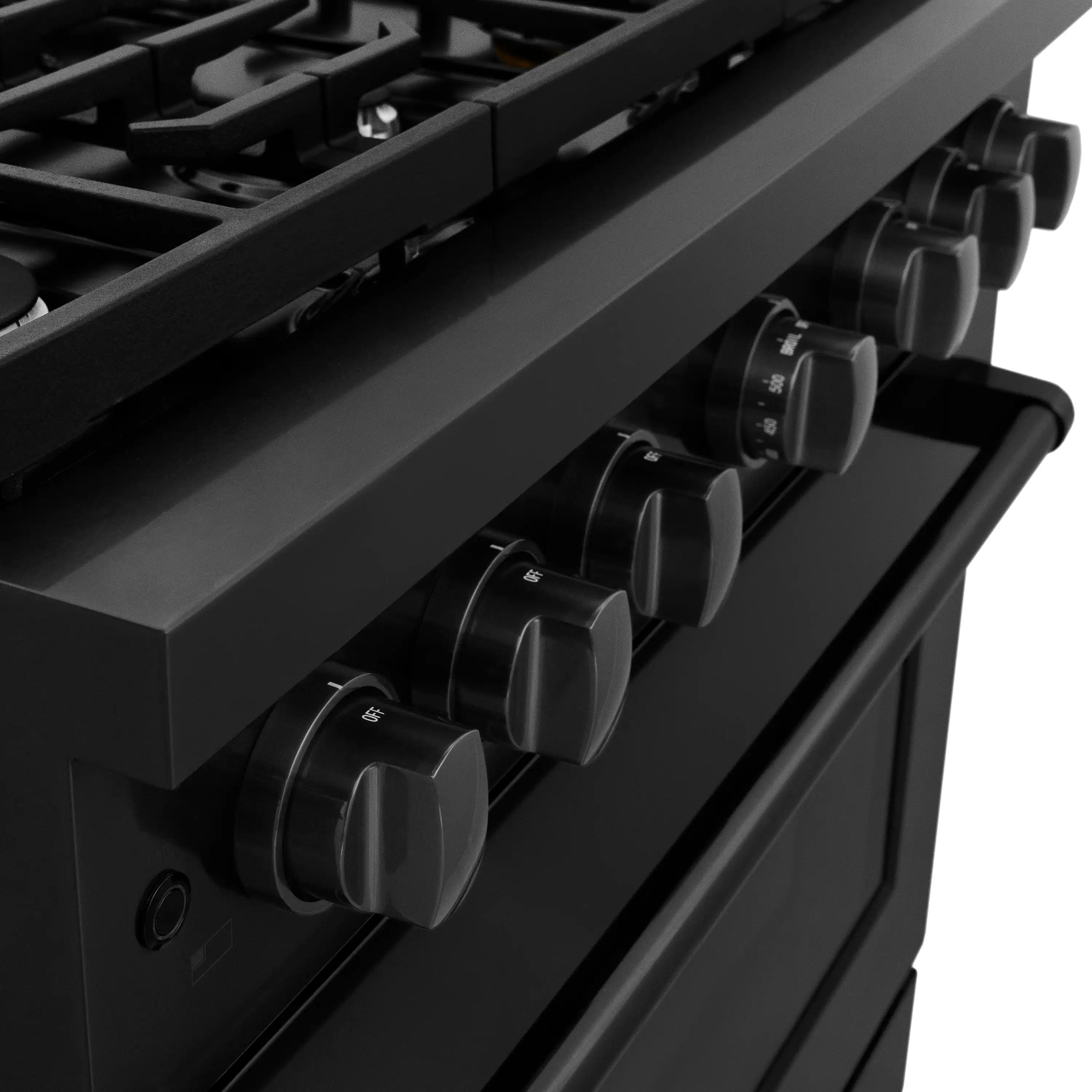 Close-up of black gas range control knobs along the front panel