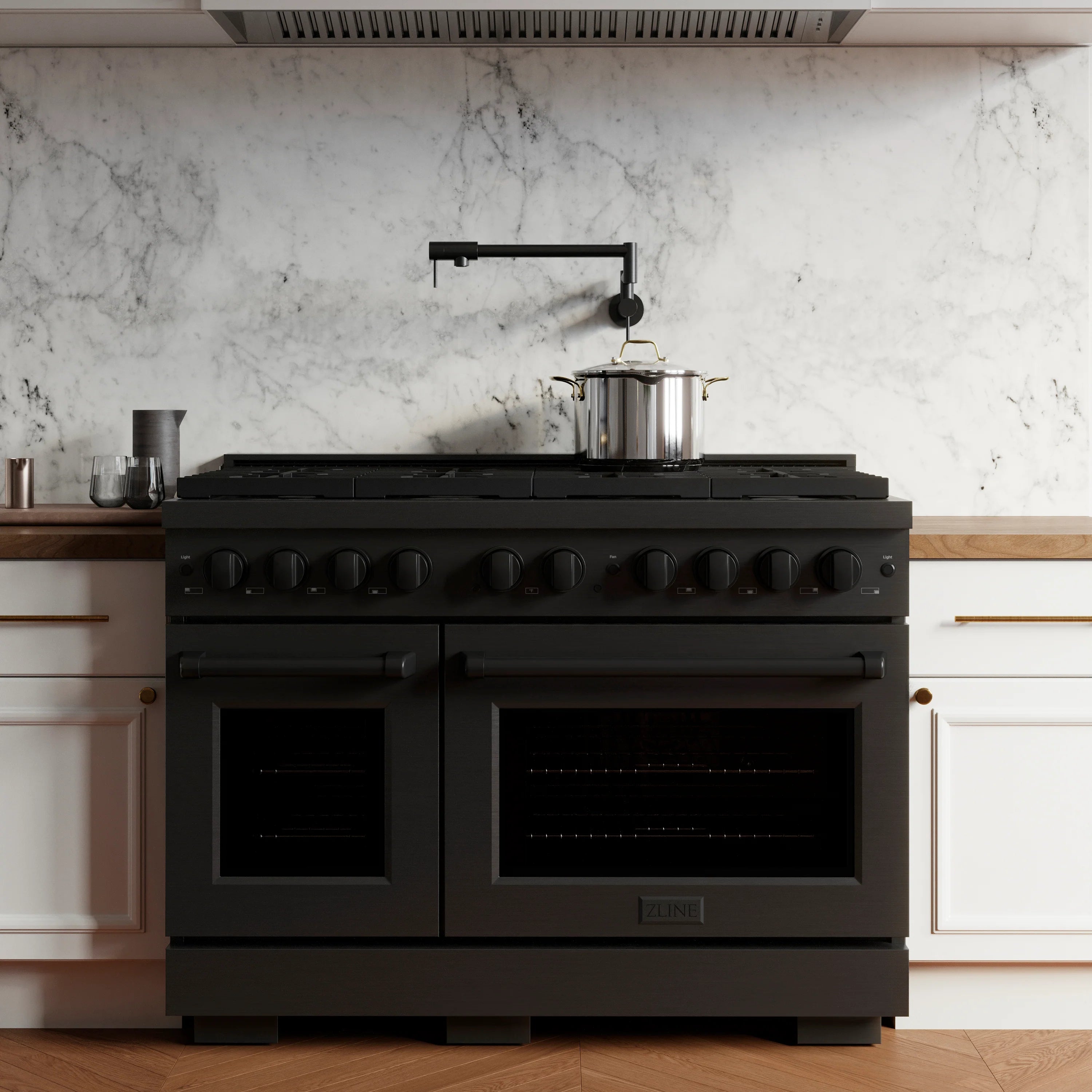 Black gas range with double oven, top burners, and control knobs