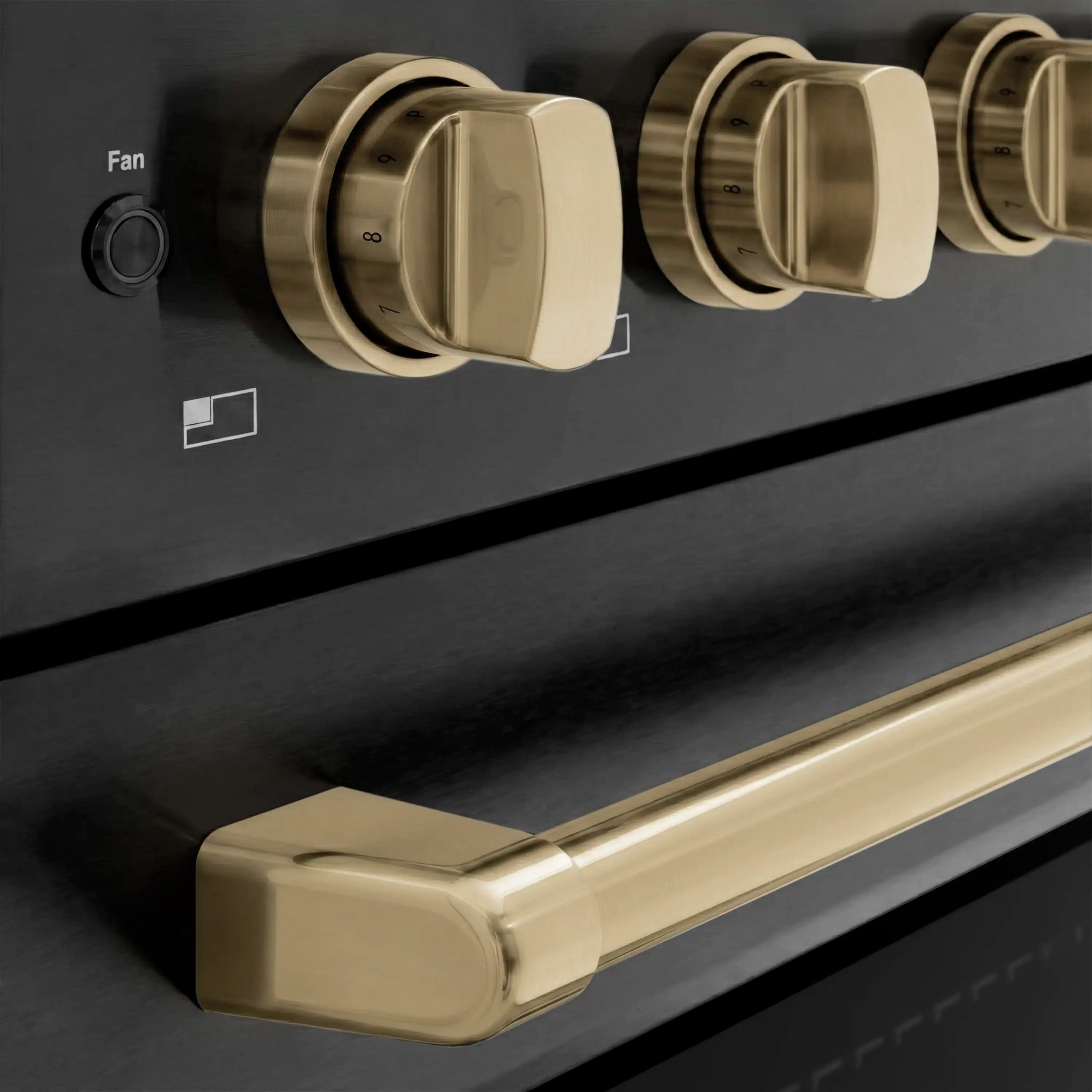 Champagne bronze control knobs and oven handle on black stainless induction range