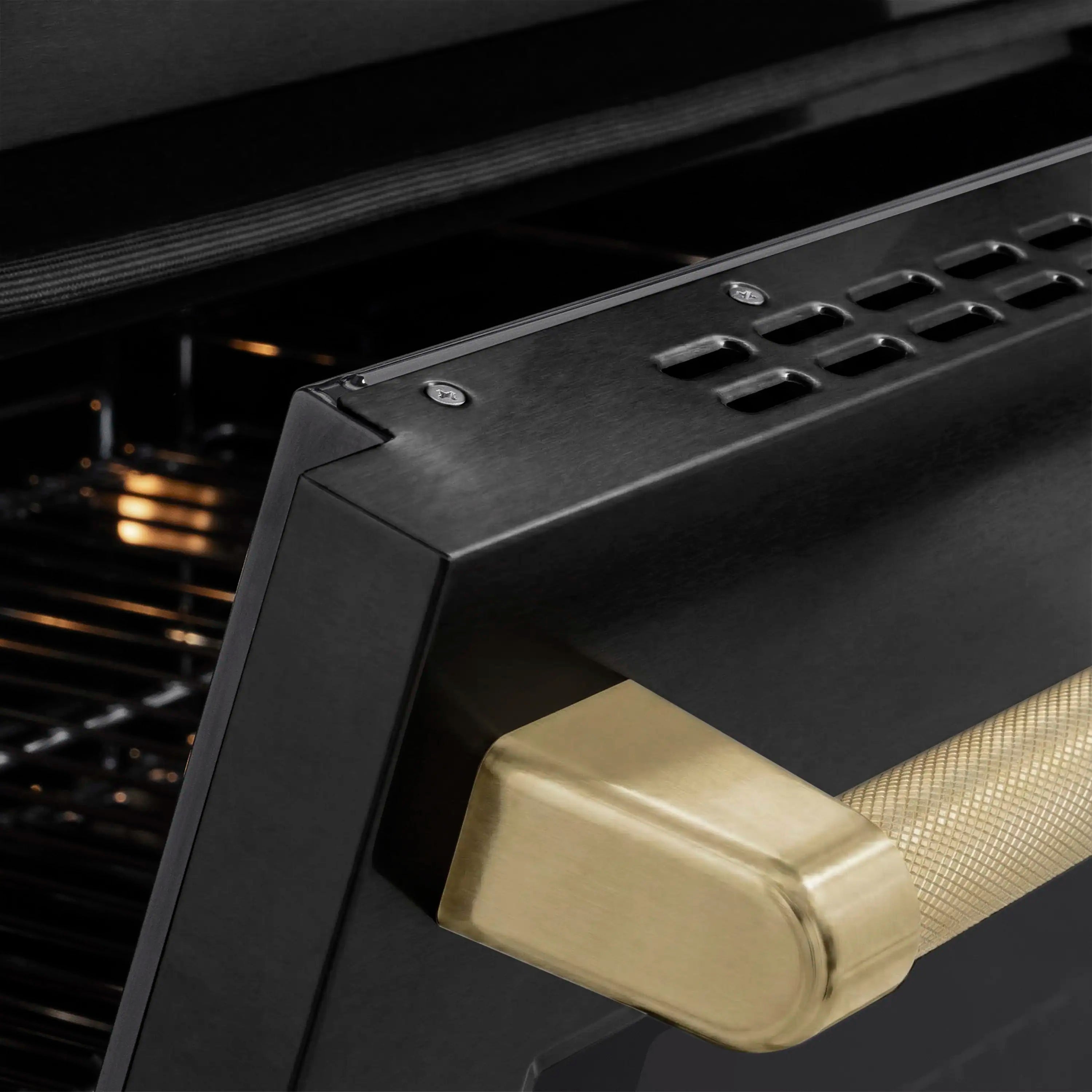 Champagne bronze handle accent on black stainless oven door