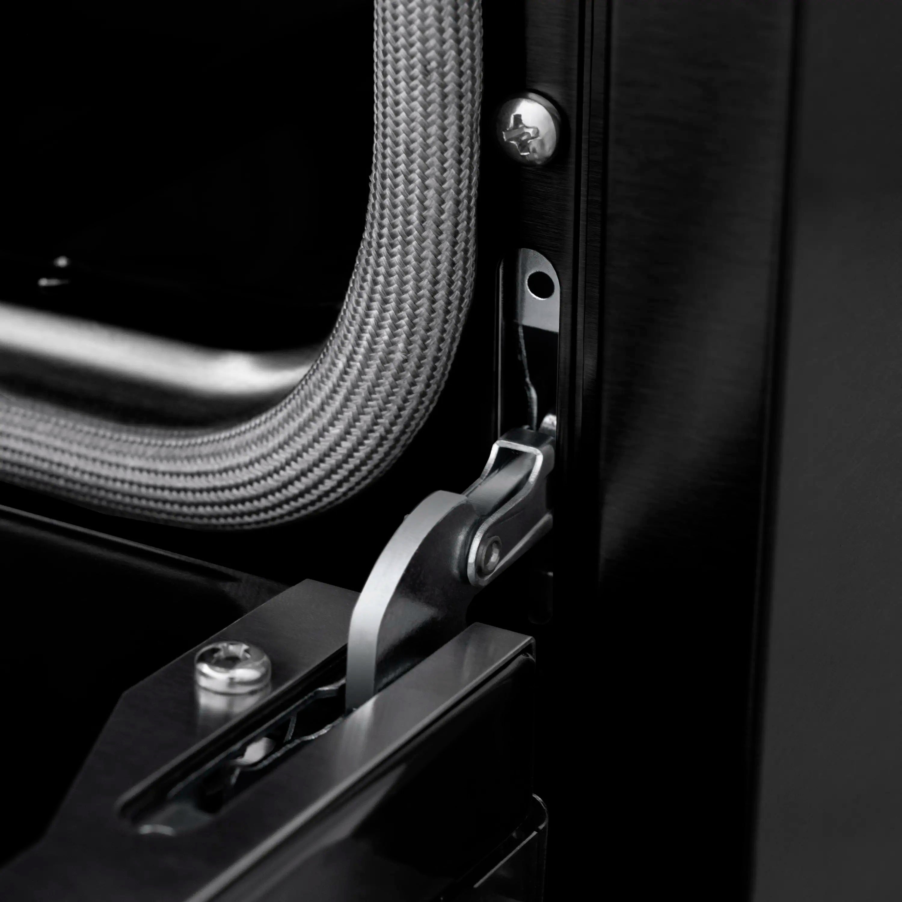 Oven door hardware with champagne bronze accent handle on black stainless frame