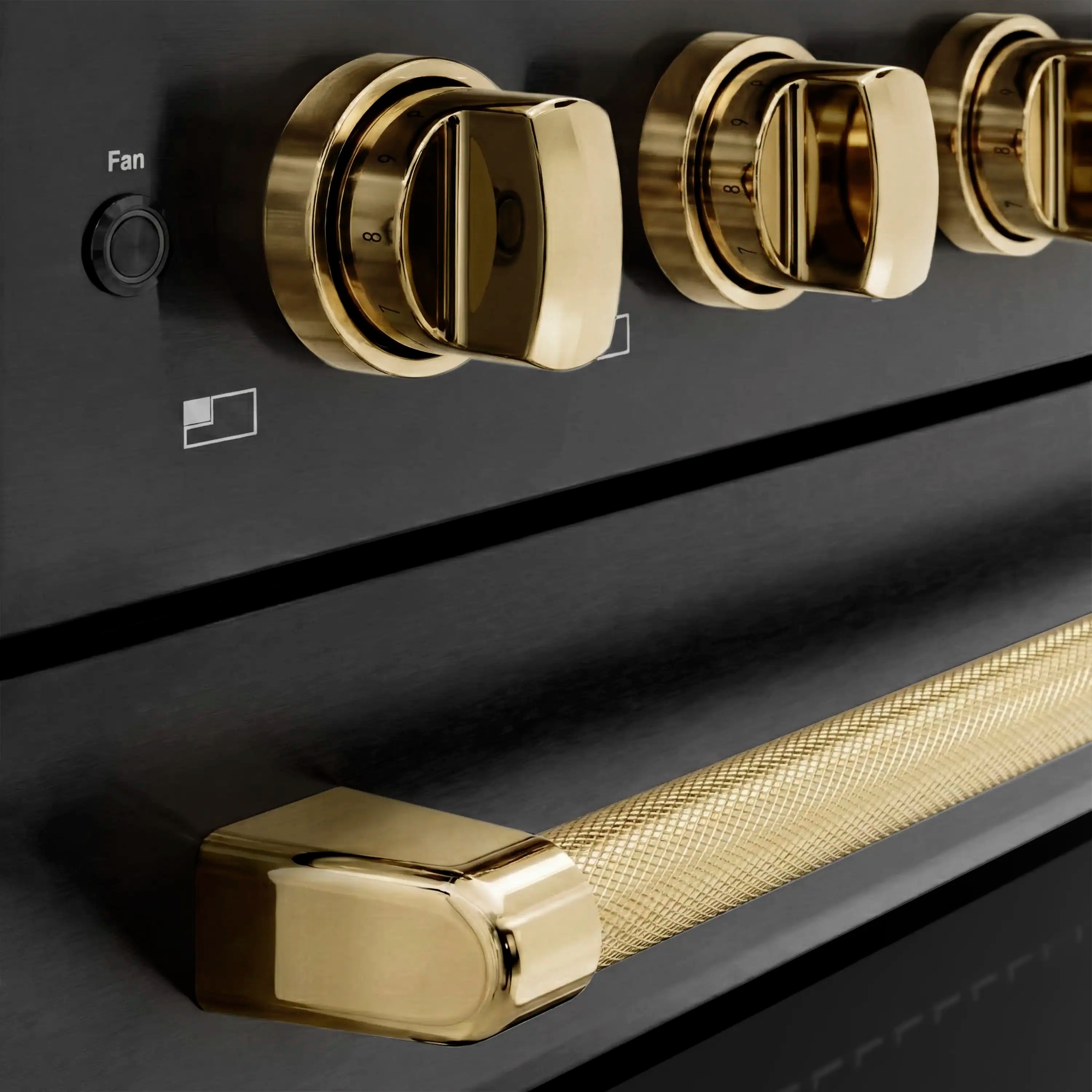 Black stainless induction range control knobs with polished gold helix accents