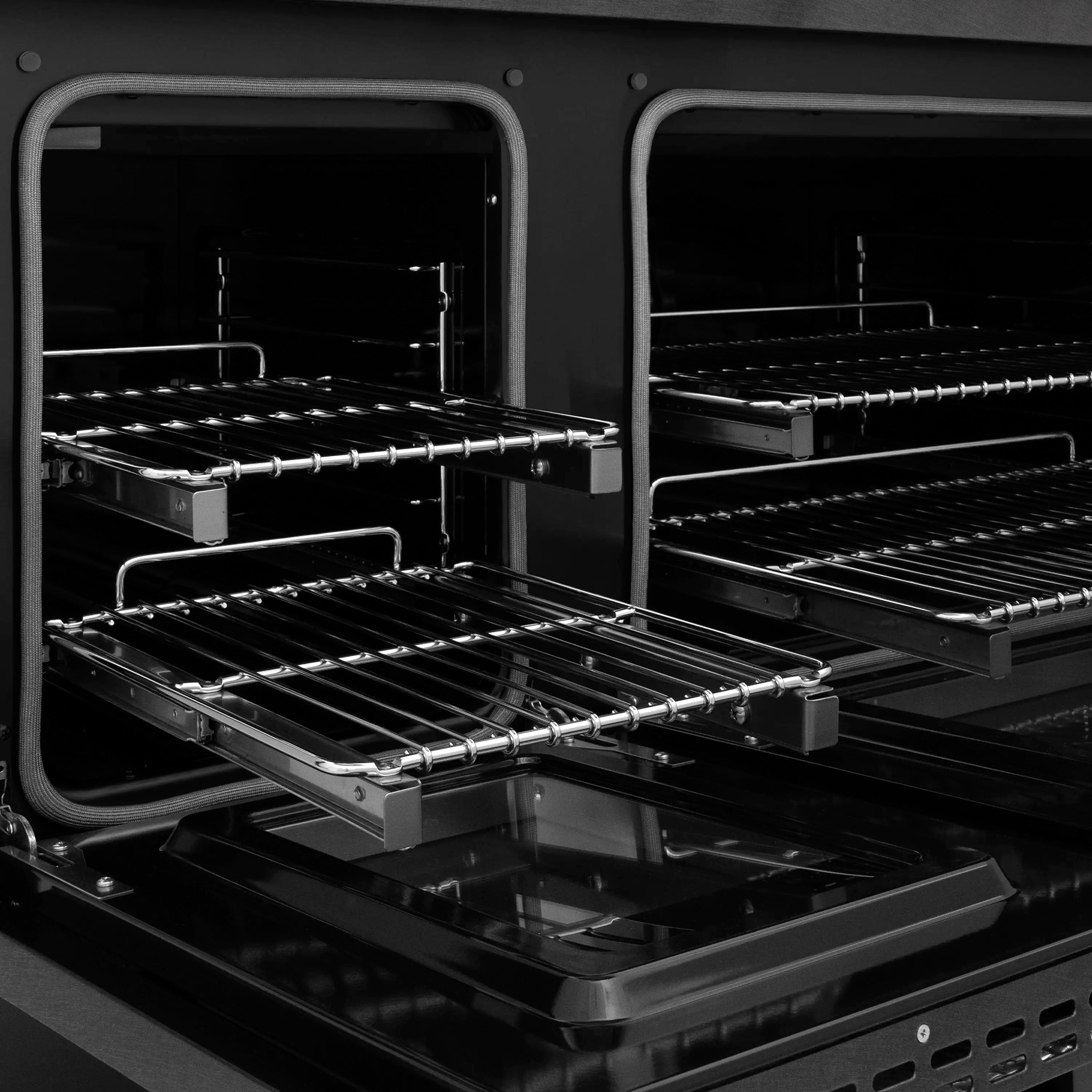 Black dual fuel oven interior with racks and broiler tray inside
