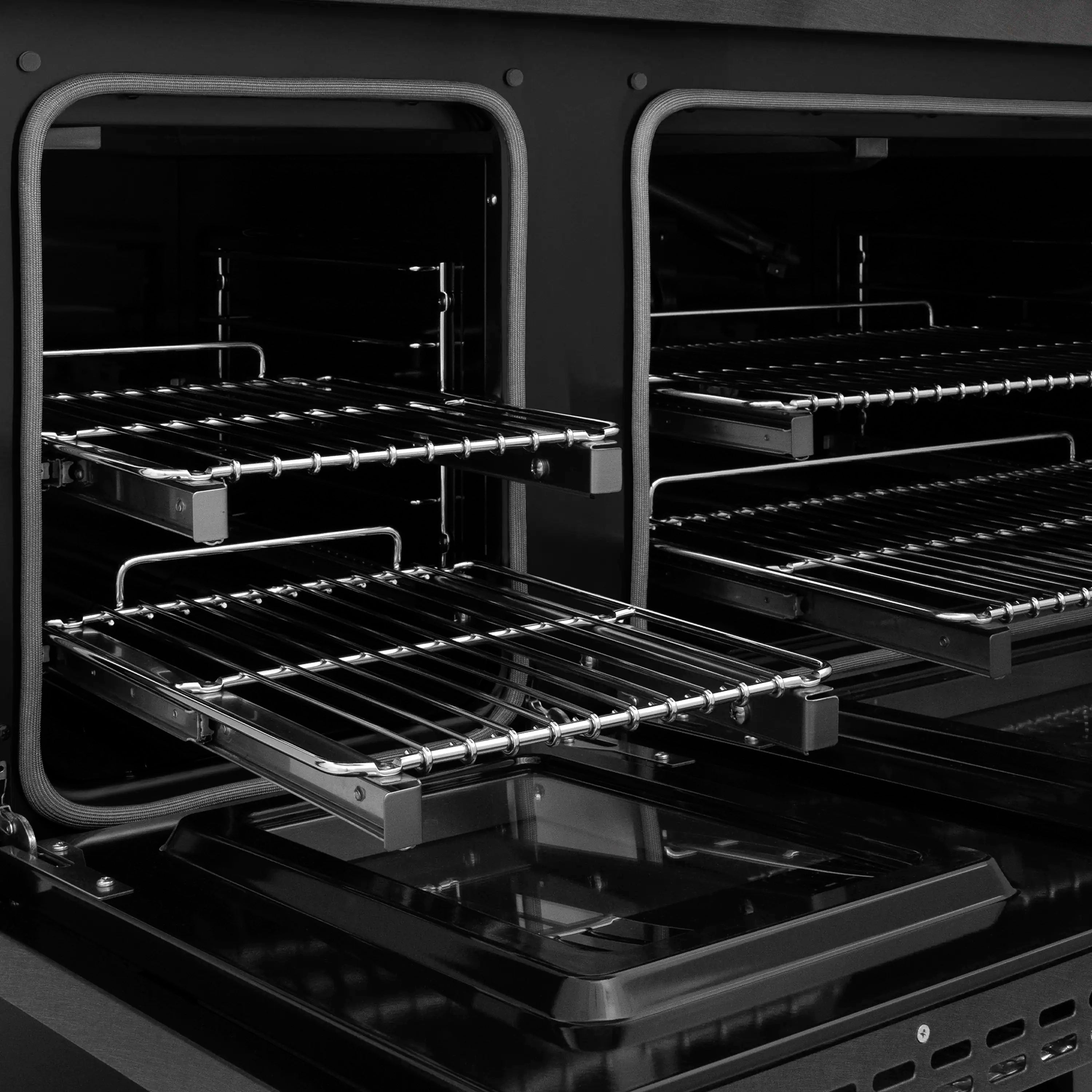Gas range oven interior with multiple racks and front cooking rails