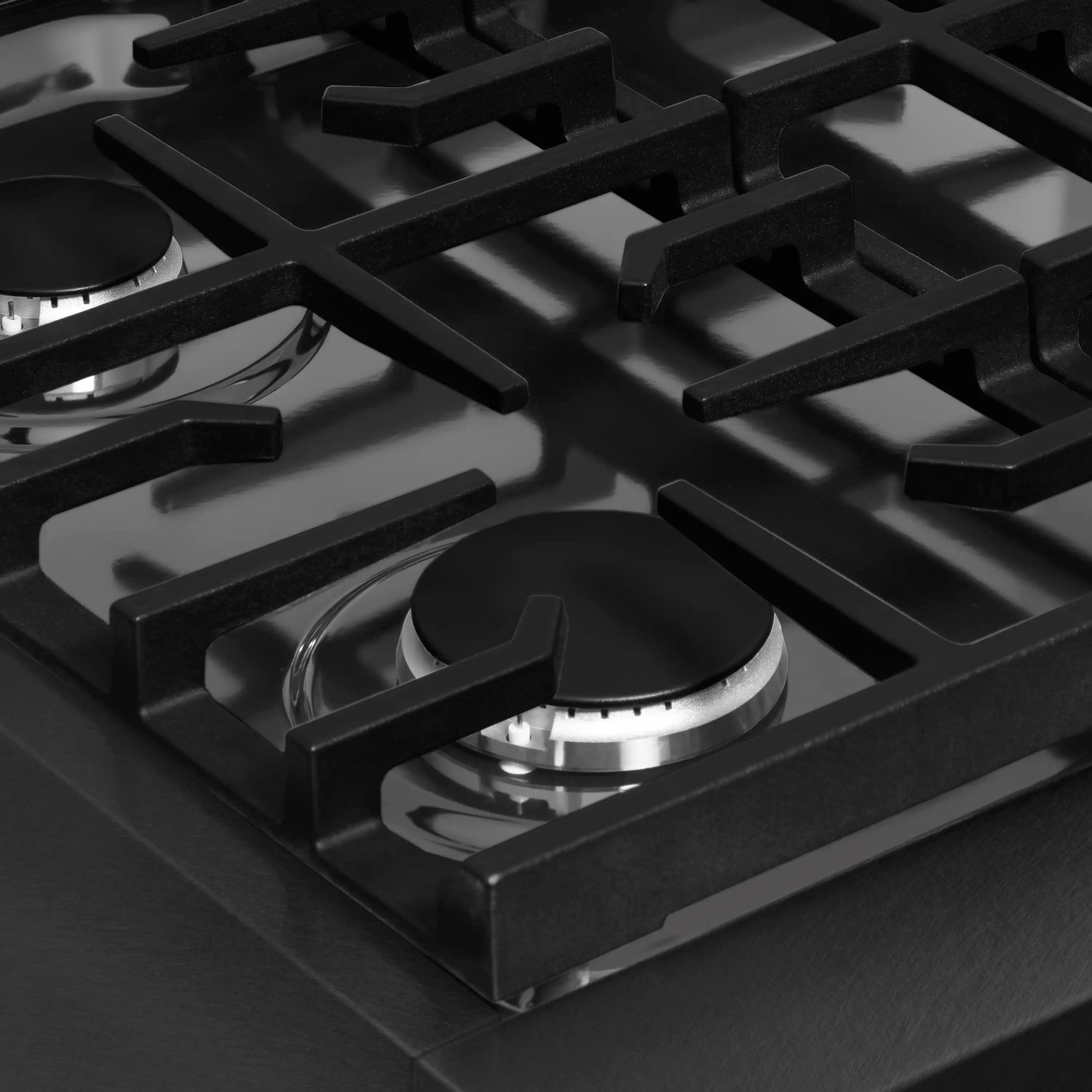 Black gas rangetop with cast iron grates and central burner control knob
