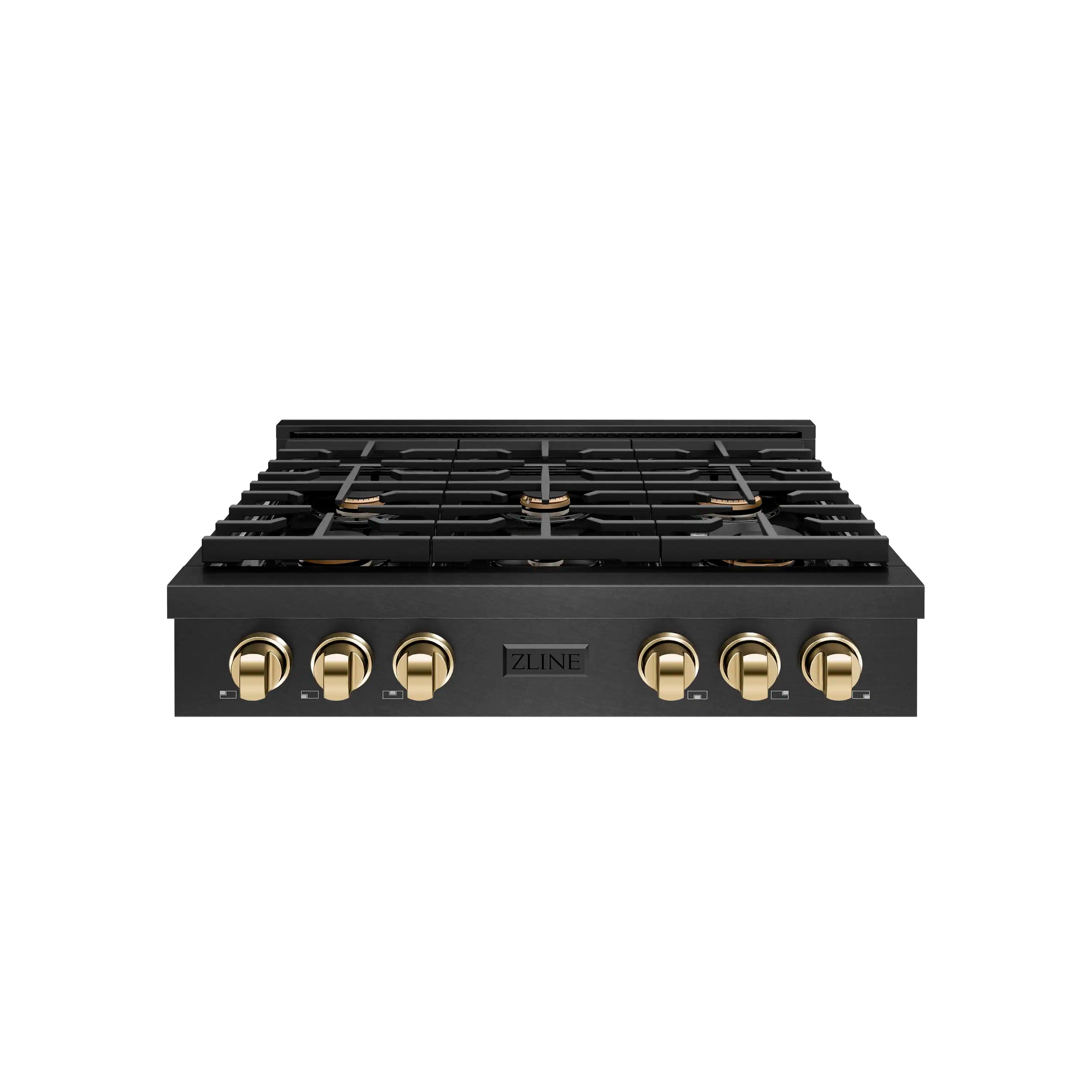 Black gas cooktop with six burners and polished gold control knobs, front view