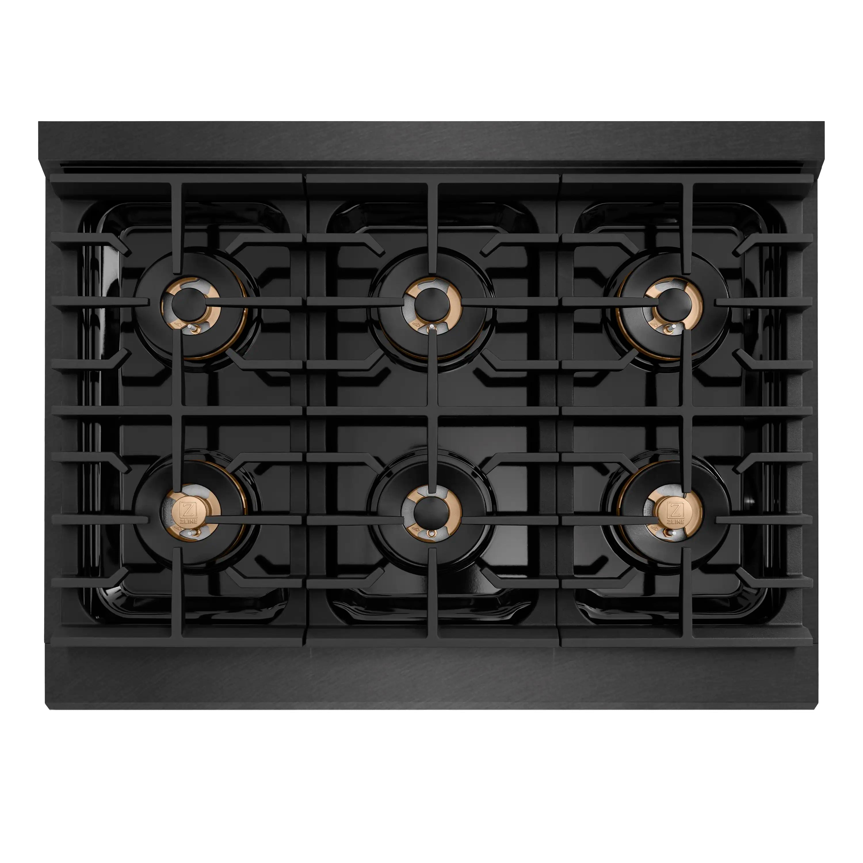 Top view of six-burner gas cooktop with black grates and brass burner caps