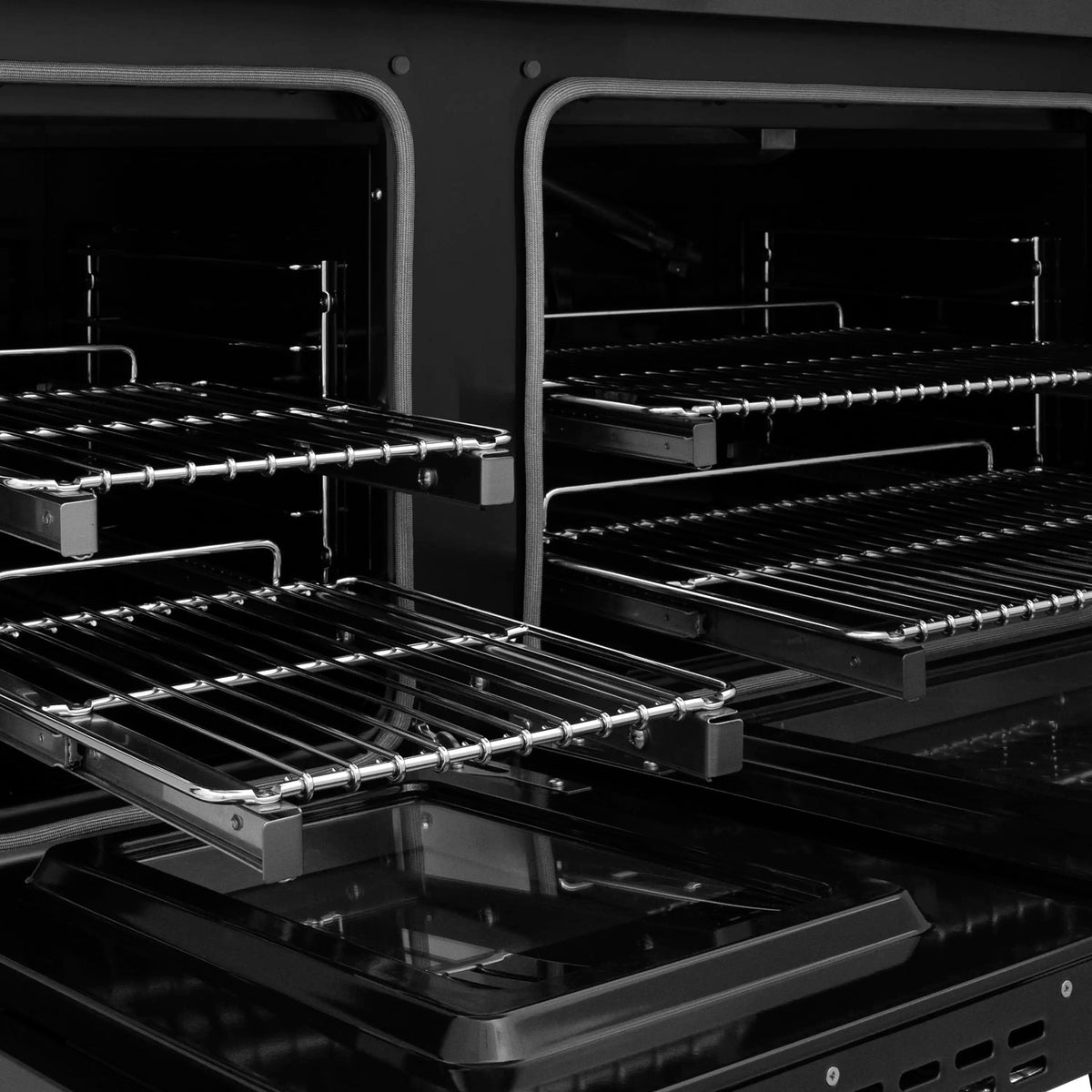 Black gas oven with multiple racks and open interior grates