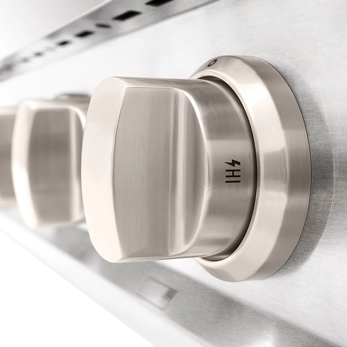 Satin stainless steel control knob with indicator markings on gas cooktop